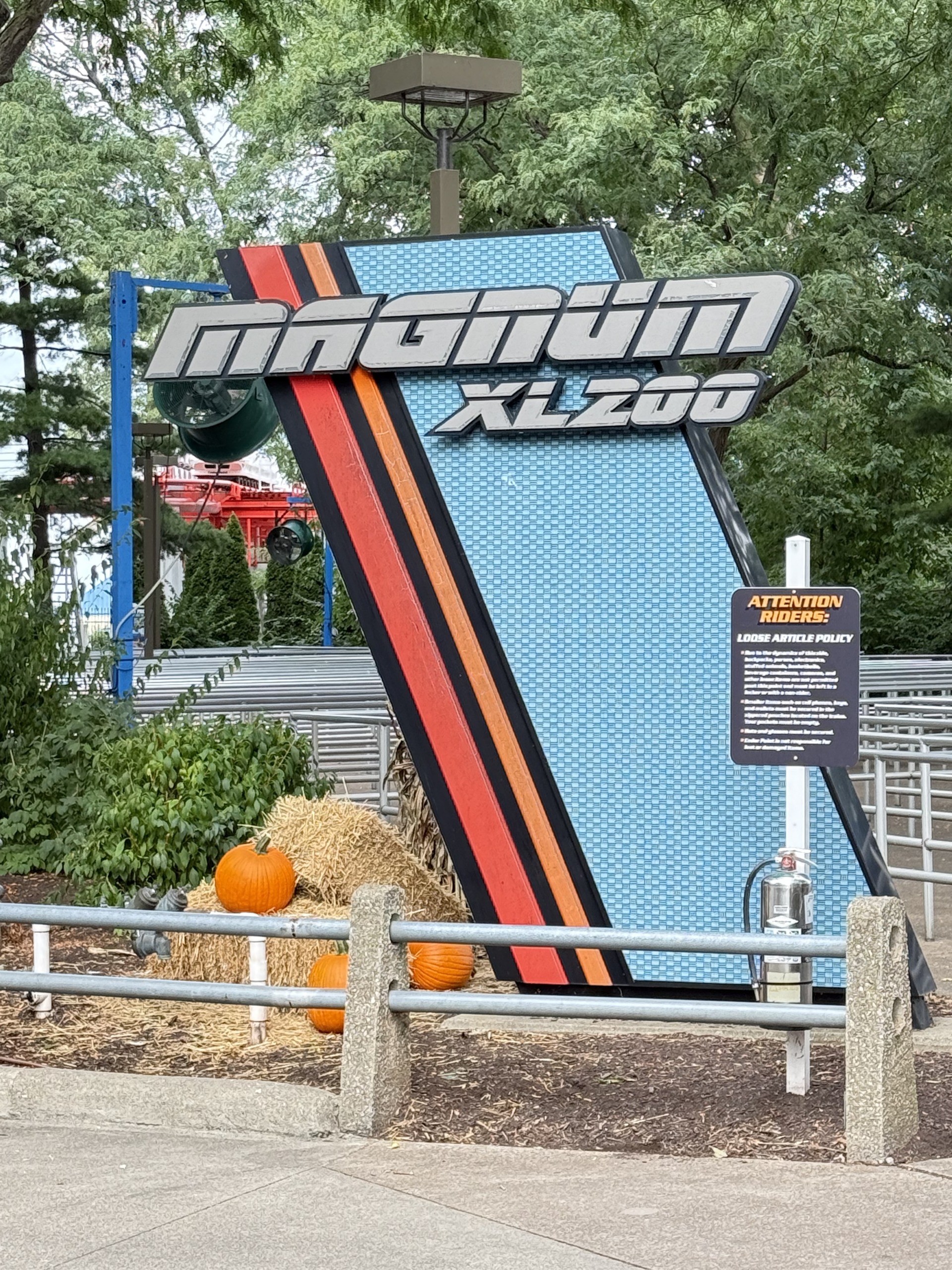The Magnum XL-200 entrance sign with HalloWeekends pumpkins and hay bales at the queue entrance