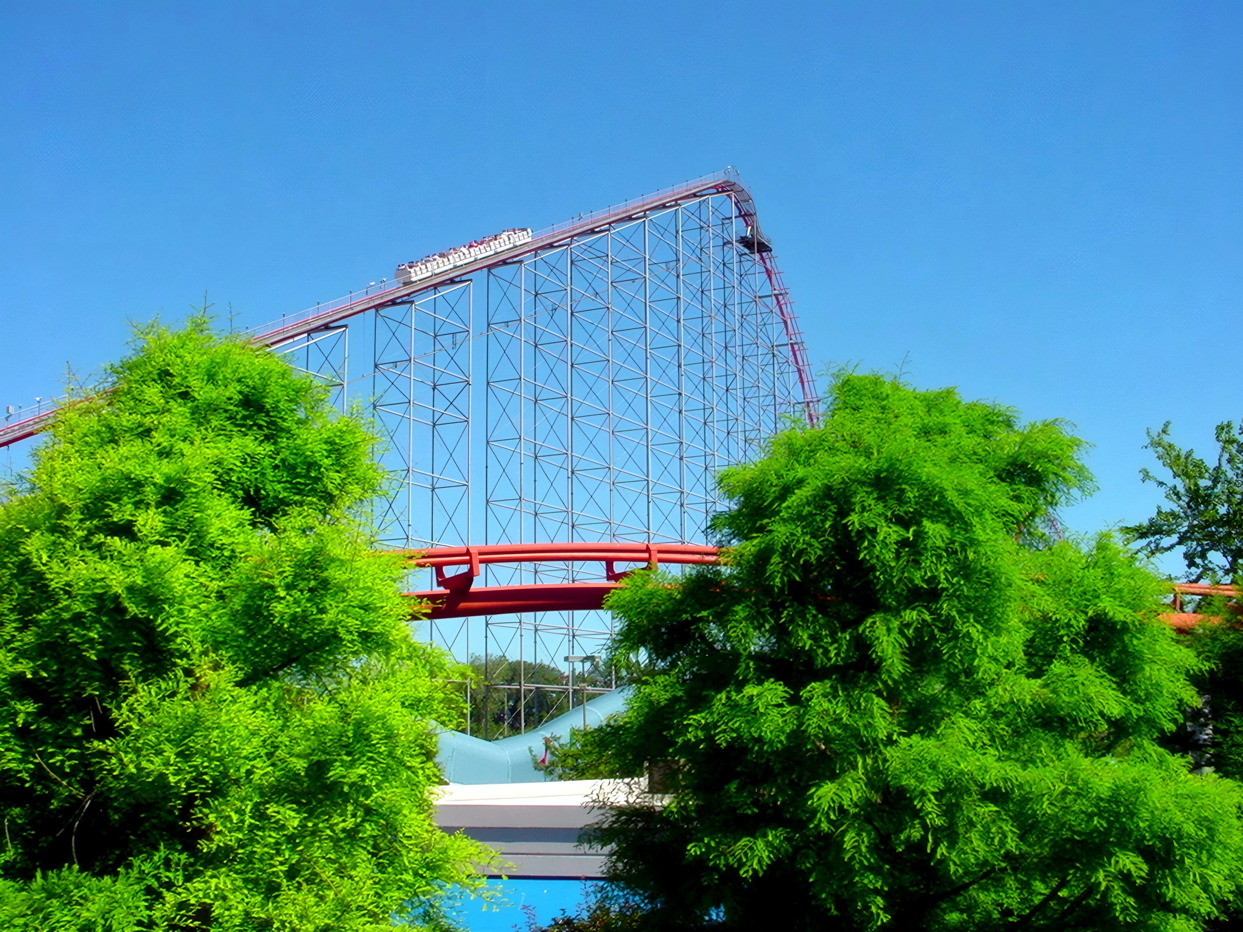 The Magnum XL-200 lift hill framed by trees at Cedar Point, July 2003