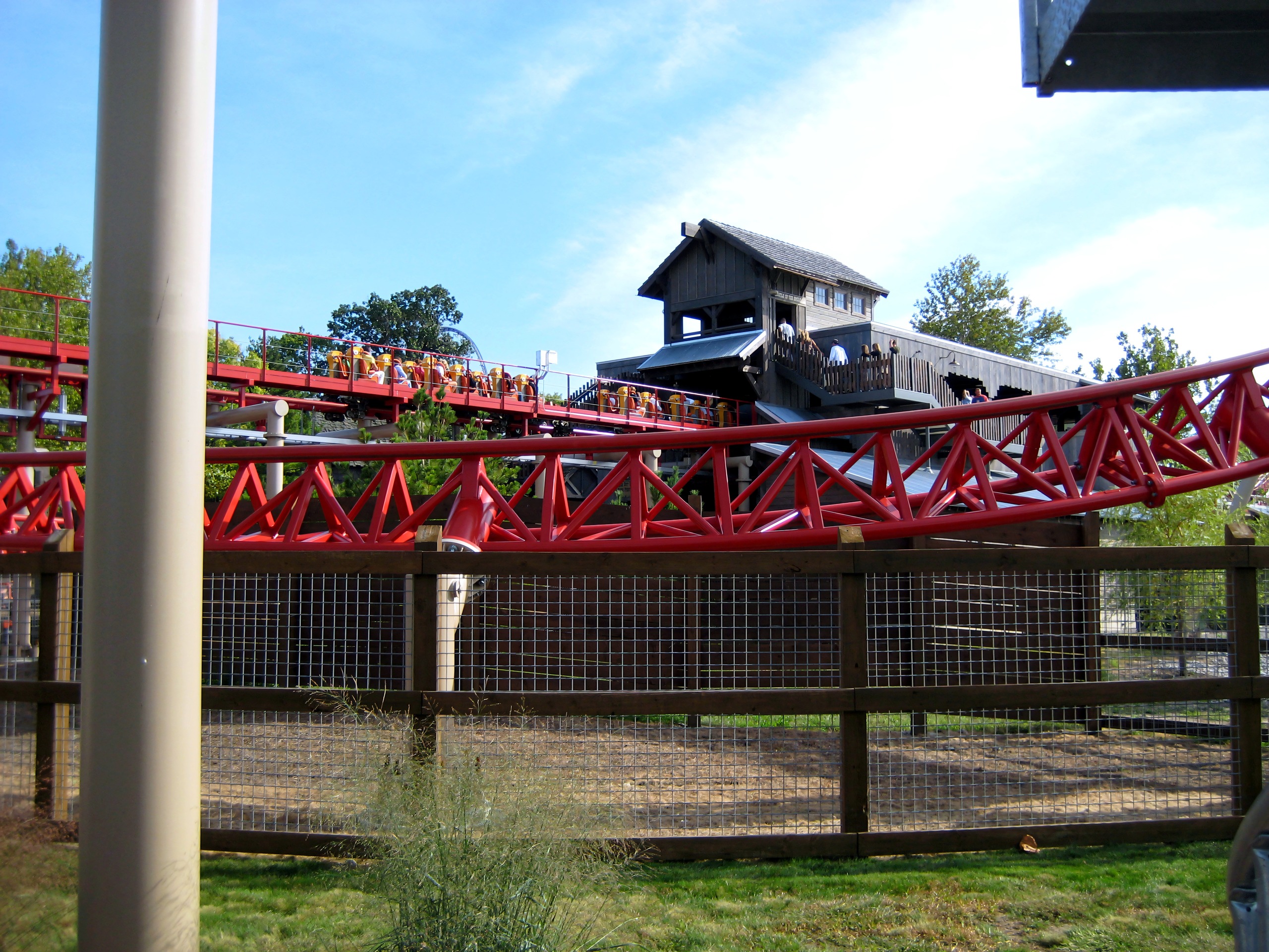 Maverick's red track passing the station building at Cedar Point, September 2007