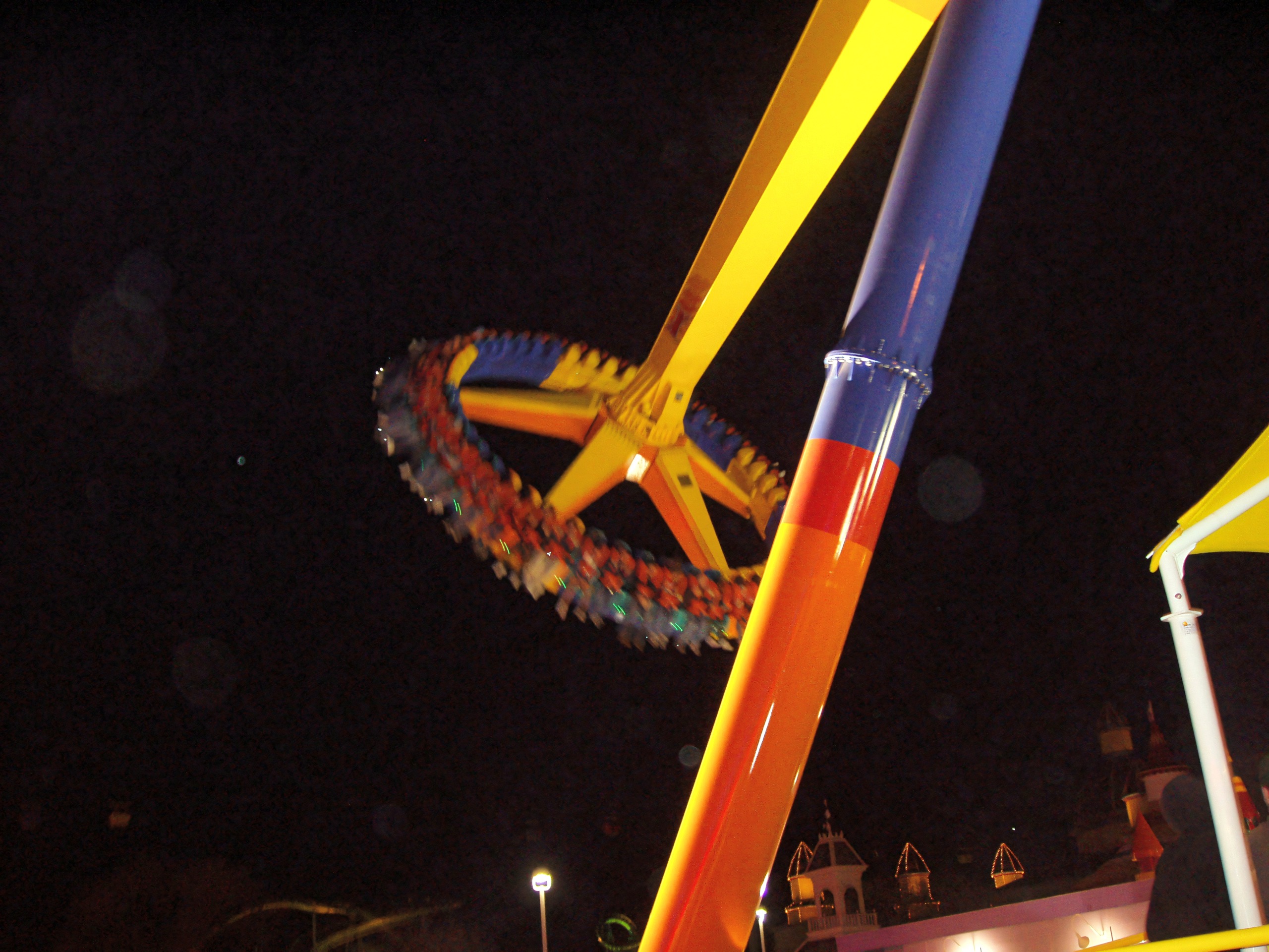 maXair's spinning ring of riders on its giant pendulum arm at night at Cedar Point, May 2005