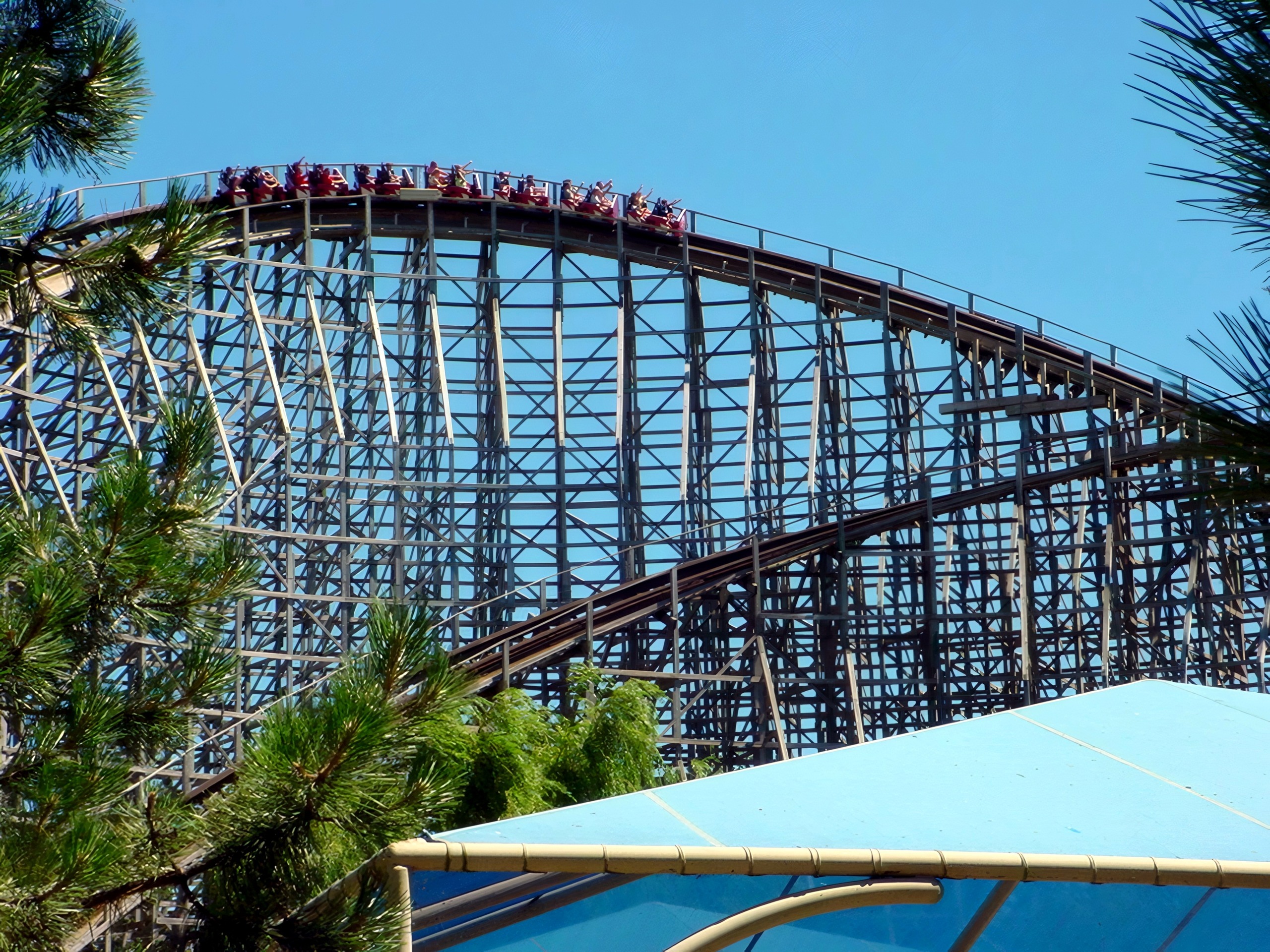 A Mean Streak train cresting a hill above the wooden structure at Cedar Point, July 2003