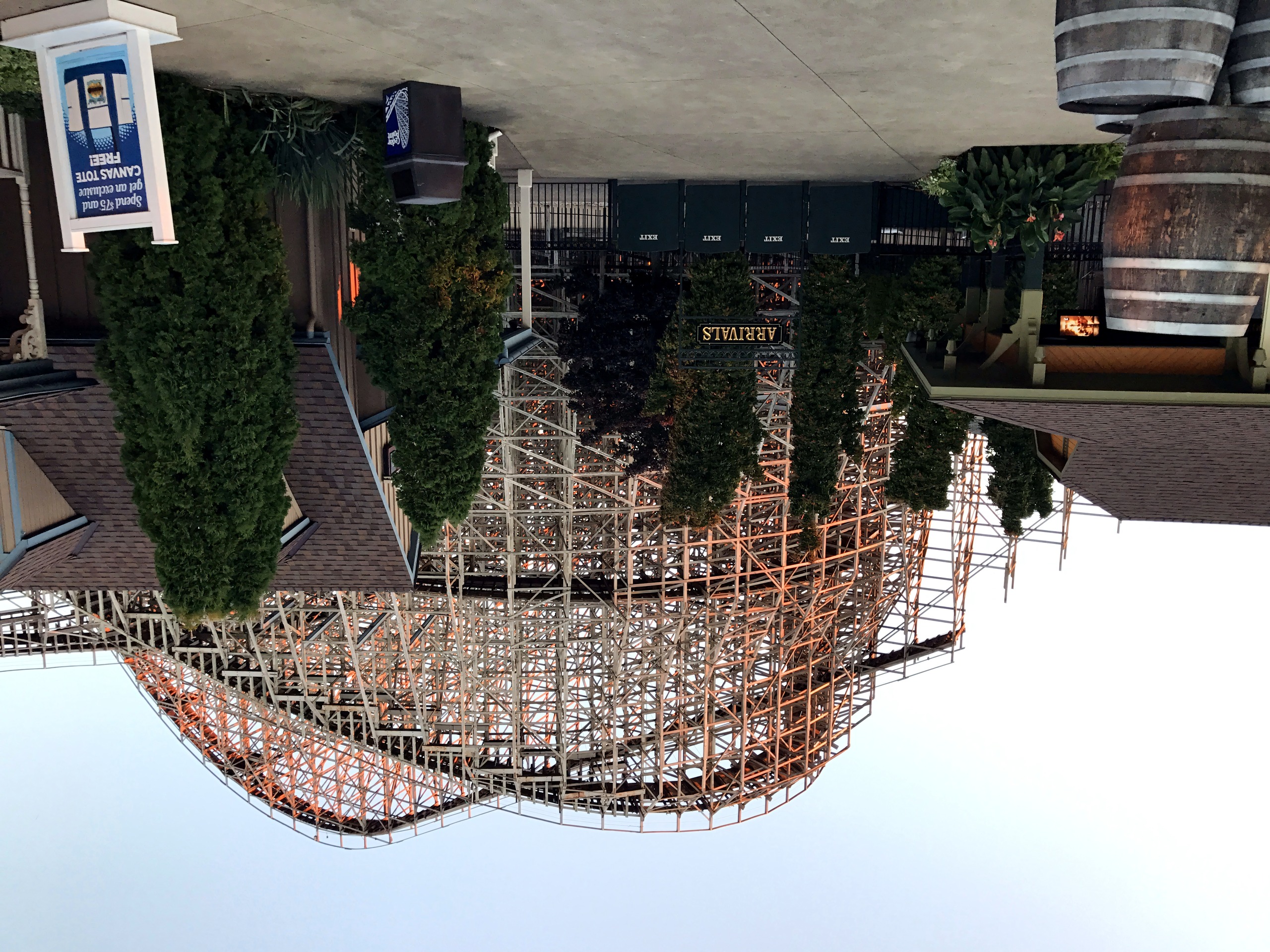 Wooden coaster towering over Arrivals building and barrels, Mean Streak, October 2016