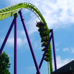 Medusa at Six Flags Great Adventure: a floorless train on the first drop below the lime-green track