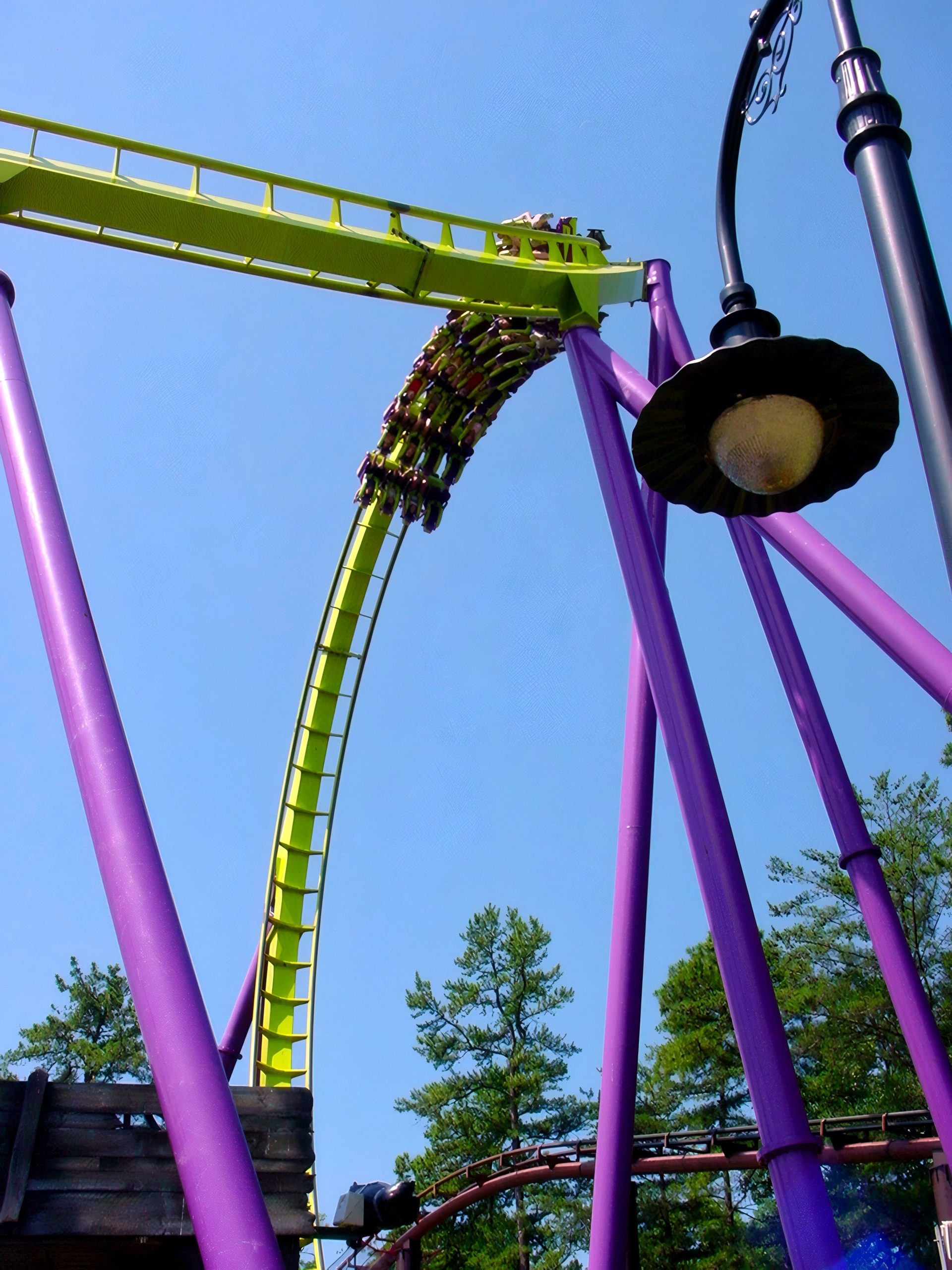 A Medusa train diving on the lime-green track beside a lamp post at Six Flags Great Adventure, July 2001