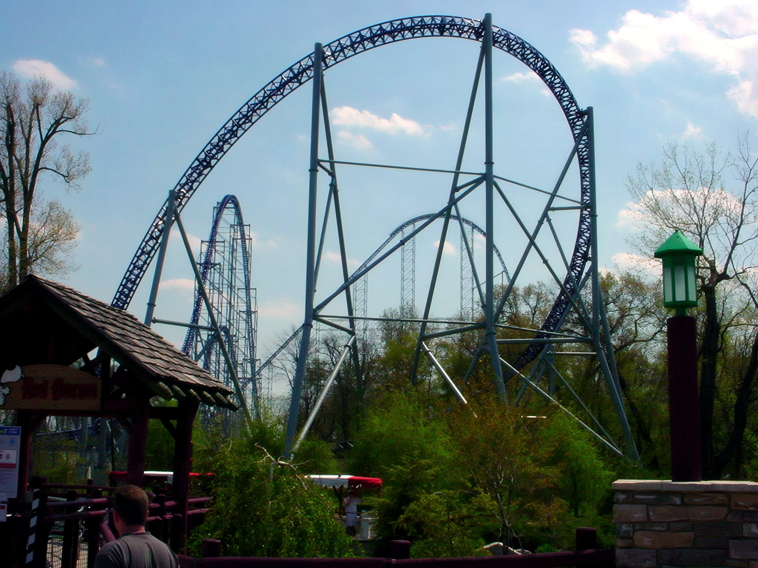 Blue coaster loop again, Red Baron gazebo sign in foreground, Millennium Force, May 2002