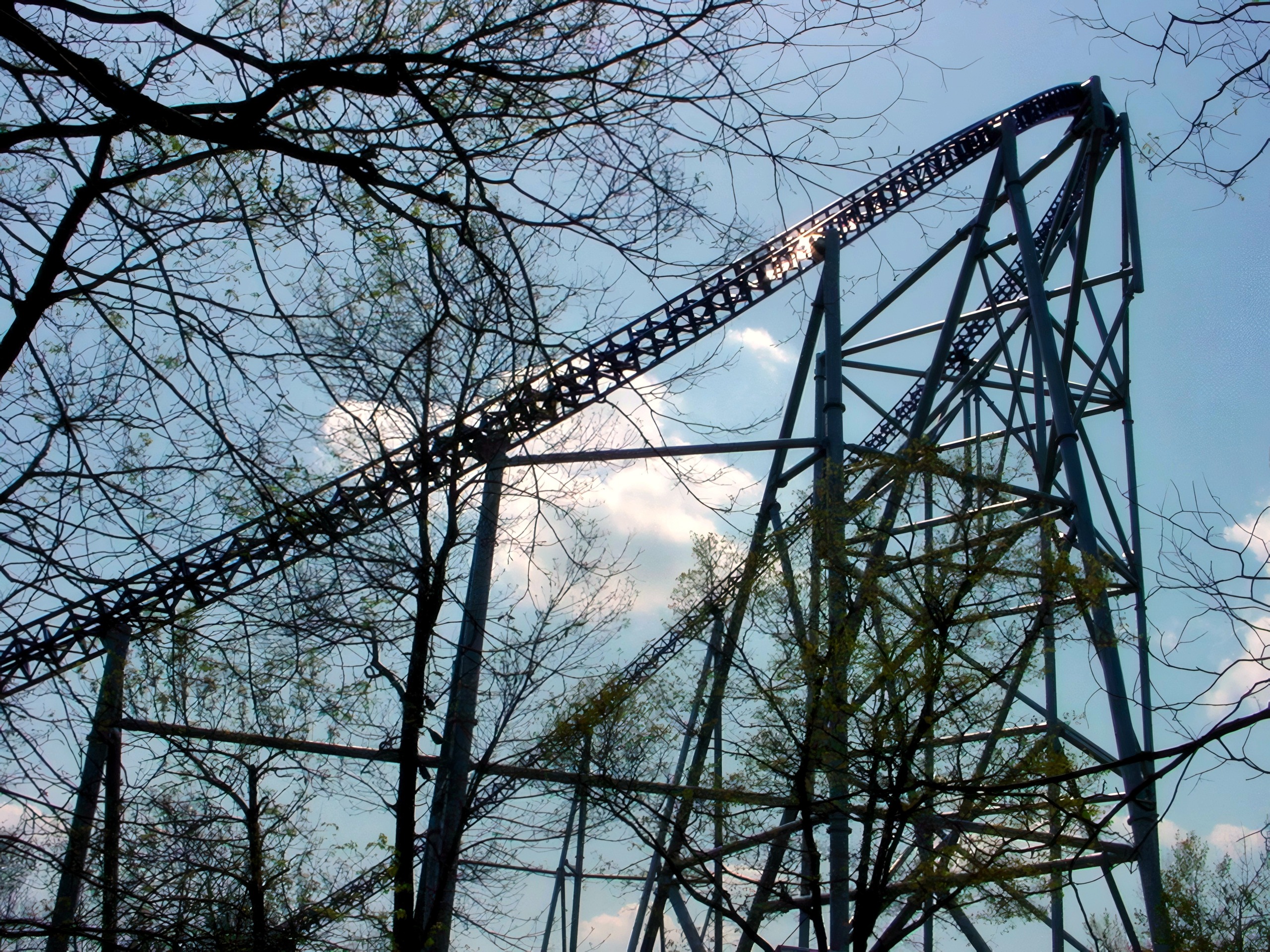 Blue track curve atop steel trestle against clear sky, Millennium Force, May 2002