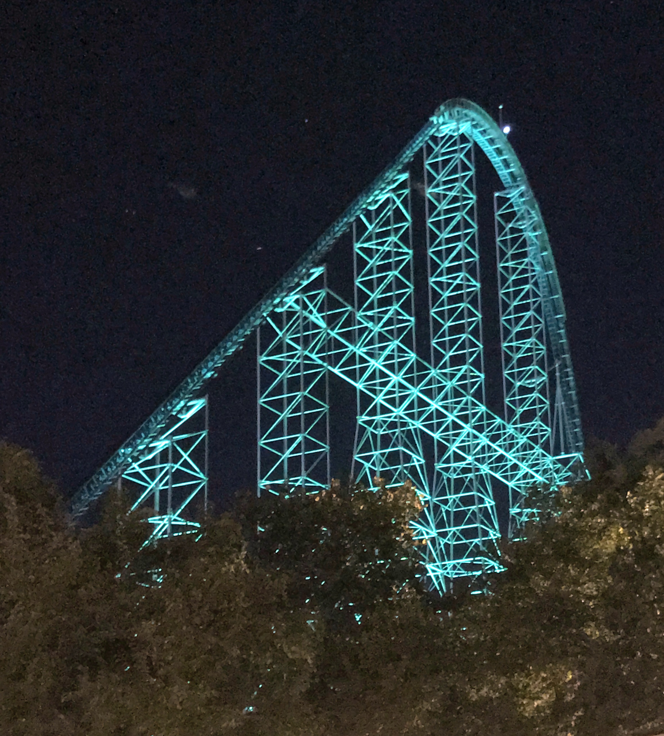 Coaster lift hill lit teal against night sky, Millennium Force, October 2016