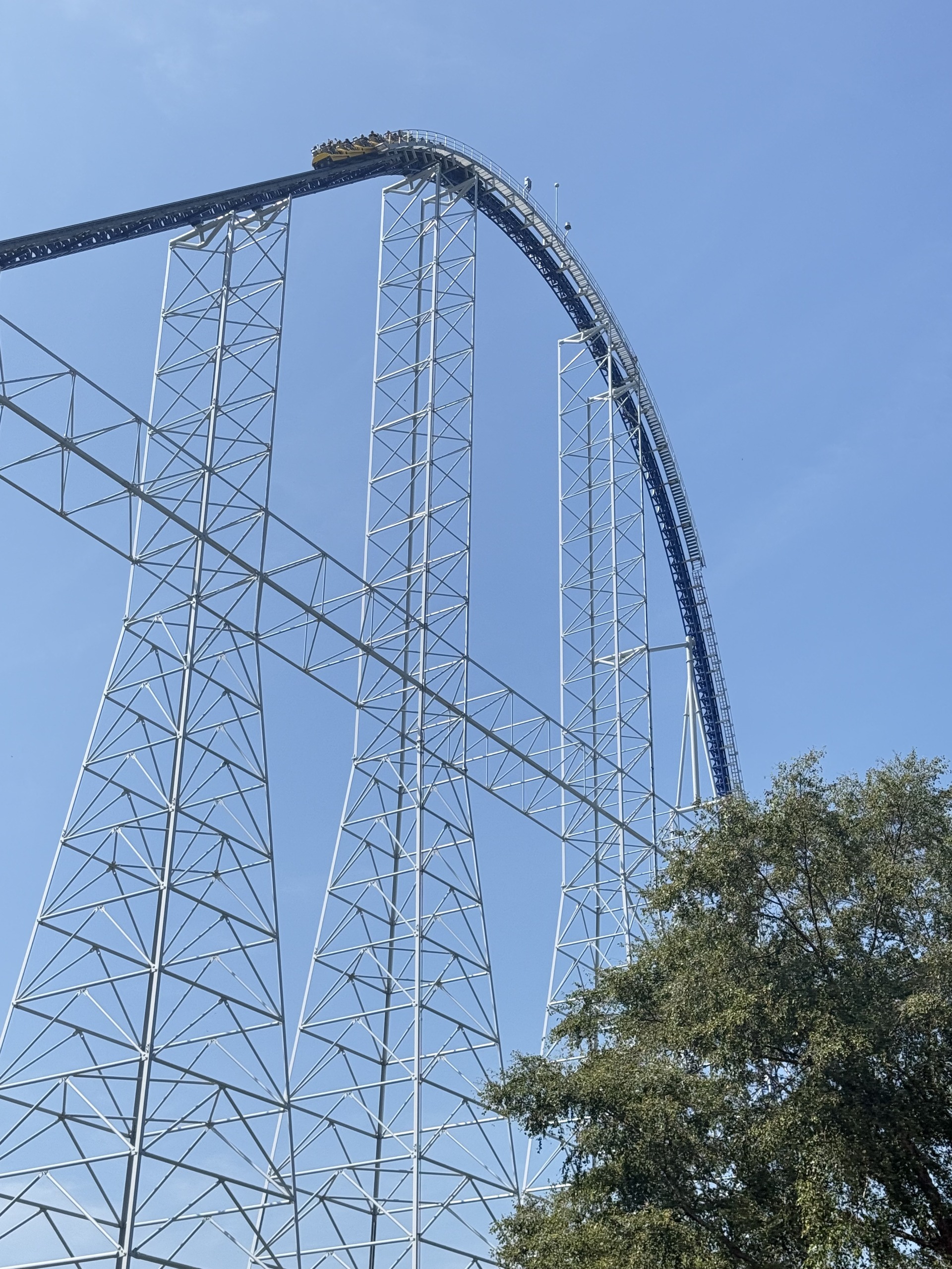 A Millennium Force train cresting the lift hill into the first drop
