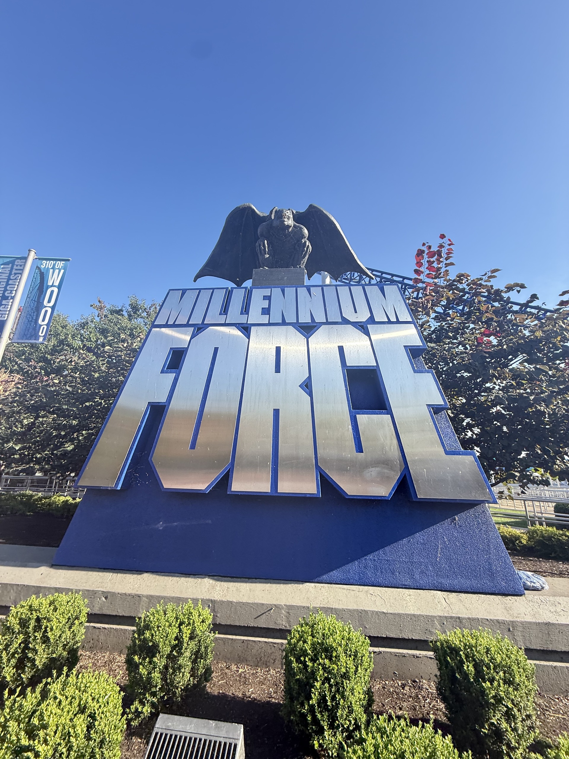 The Millennium Force entrance sign with its winged gargoyle statue