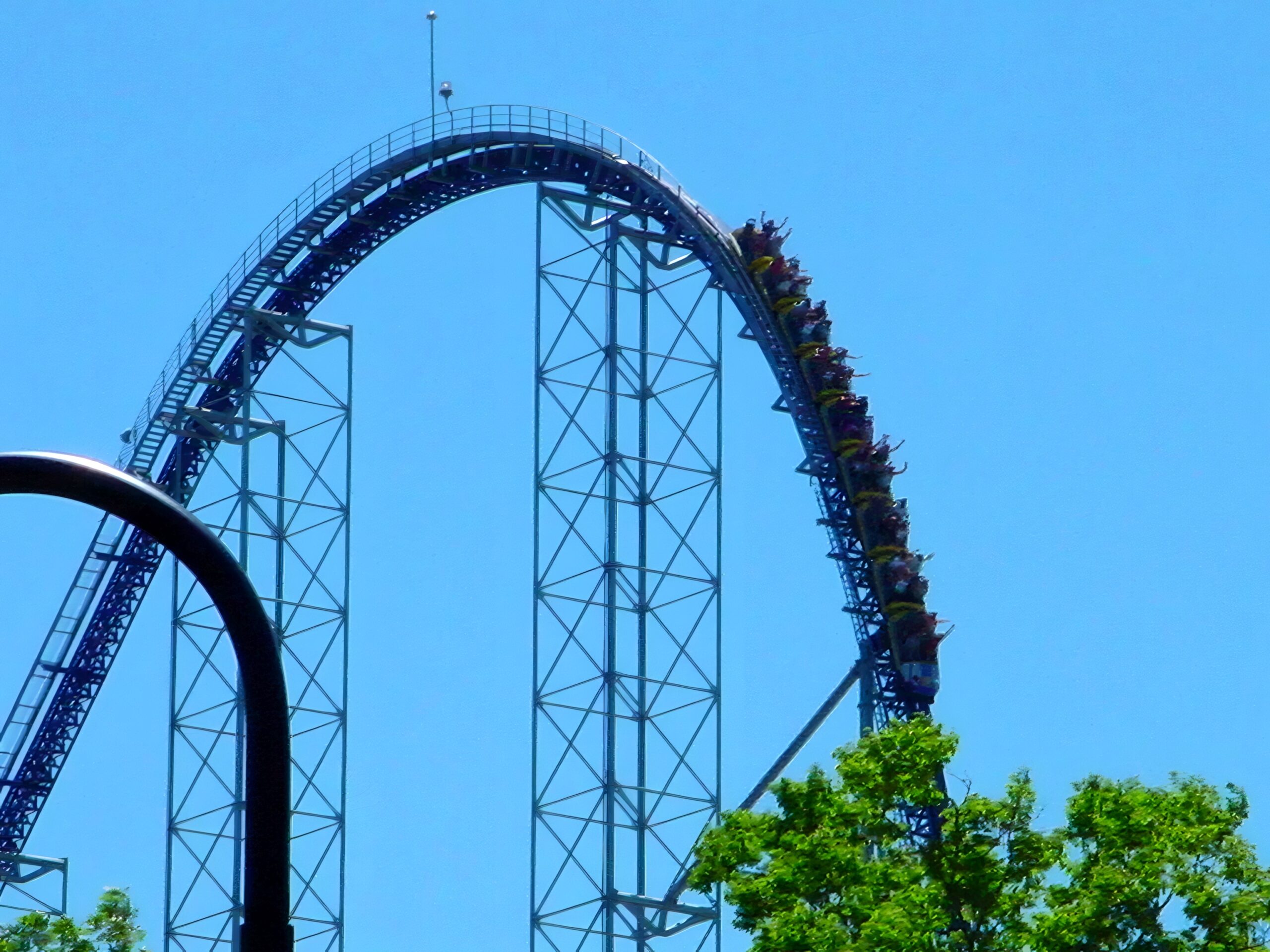 A Millennium Force train on the lift hill with track in the foreground, July 2003