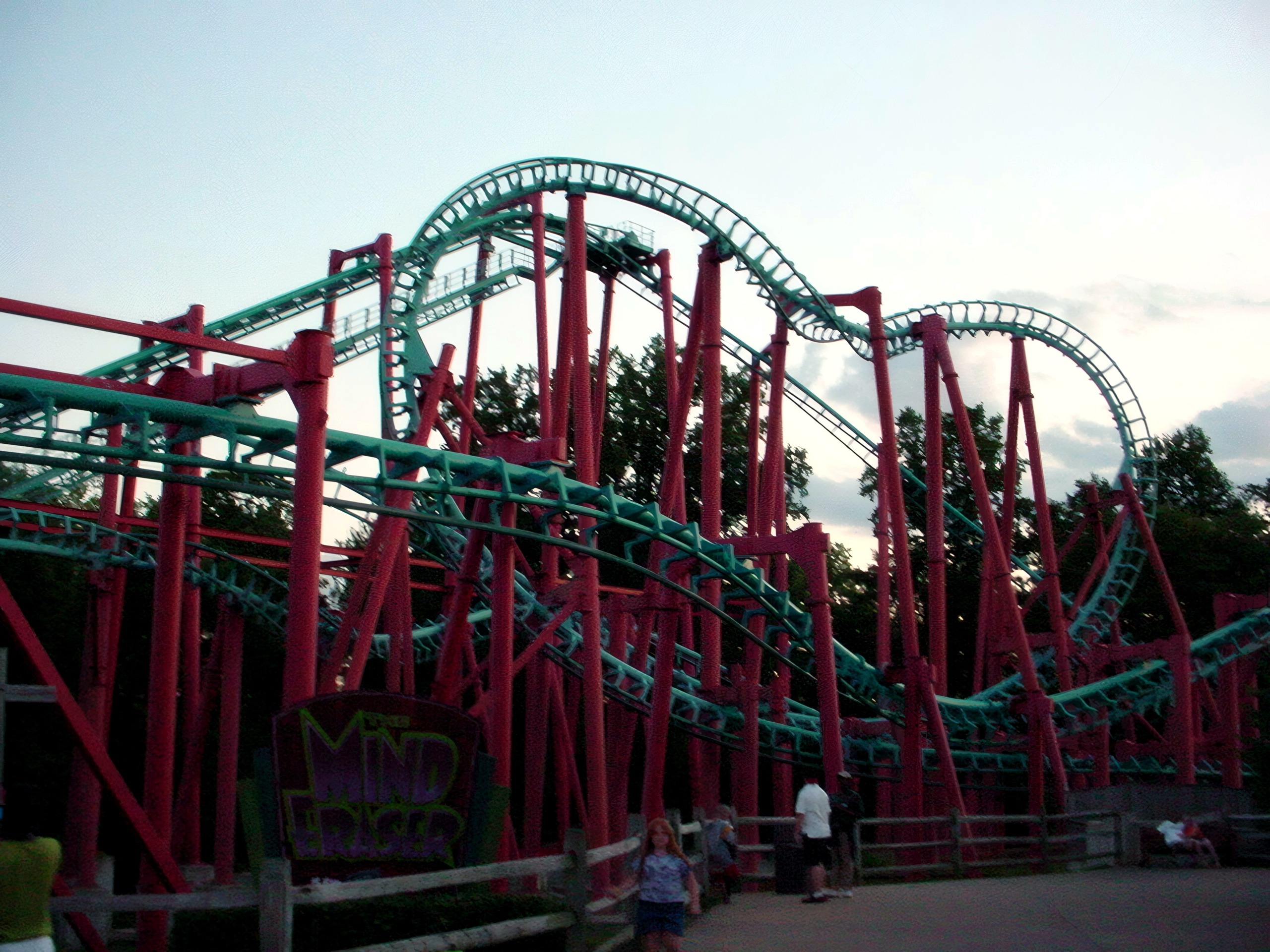 Mind Eraser's inversions and the ride's sign at dusk at Six Flags America, July 2001