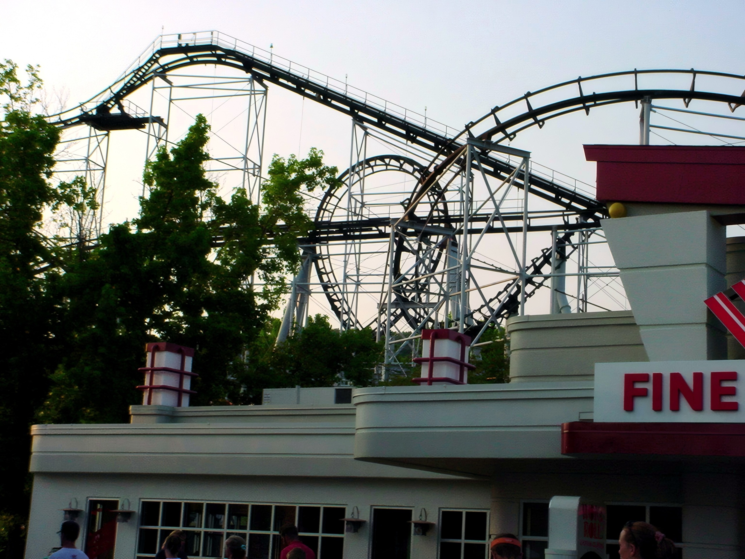 Ninja's black track and loop above the midway buildings at Mid America Adventure, June 2002