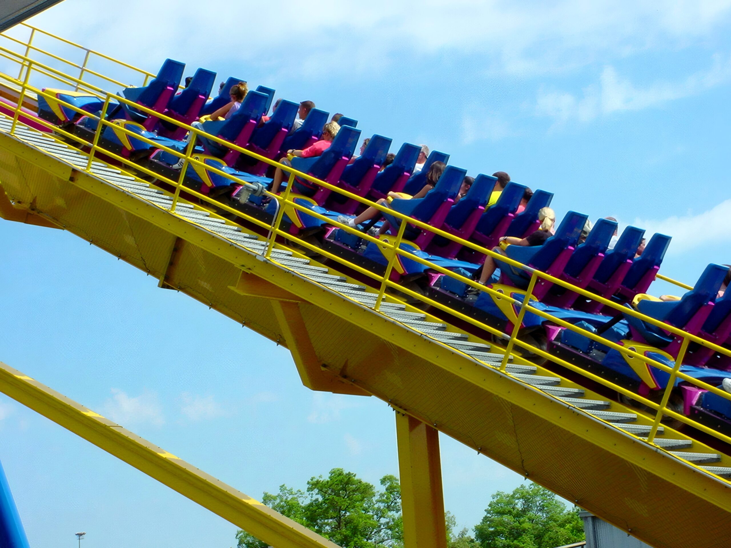 Riders climbing Nitro's lift hill on the yellow track, July 2001