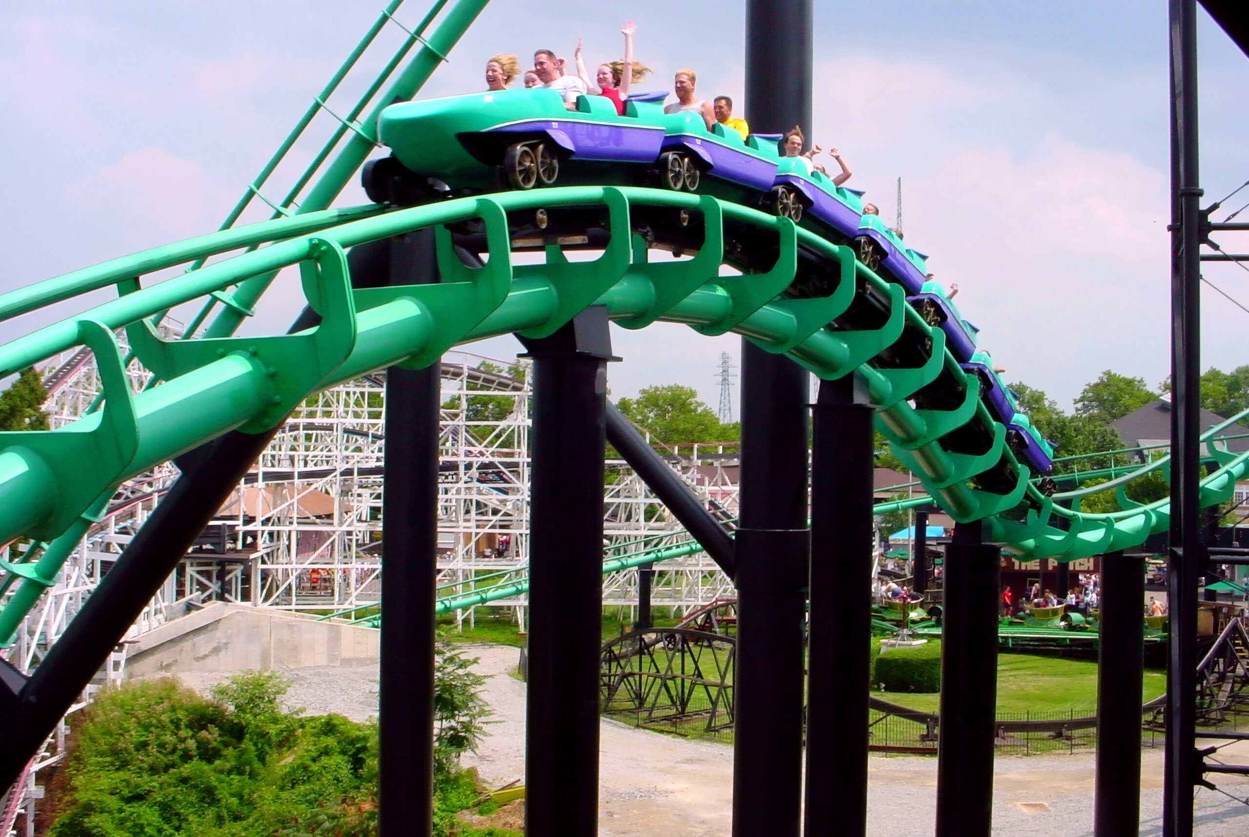 A Phantom's Revenge train cresting a hill with riders' hands up, July 2003