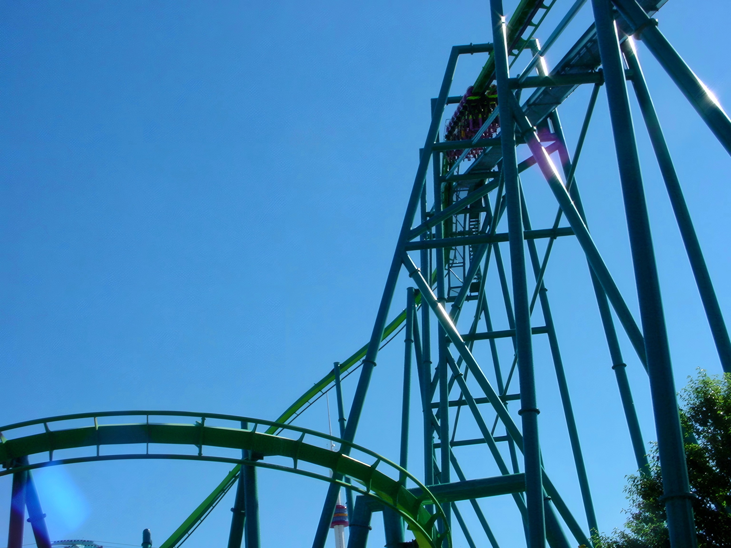 Coaster lift hill tower against blue sky, Raptor, July 2003