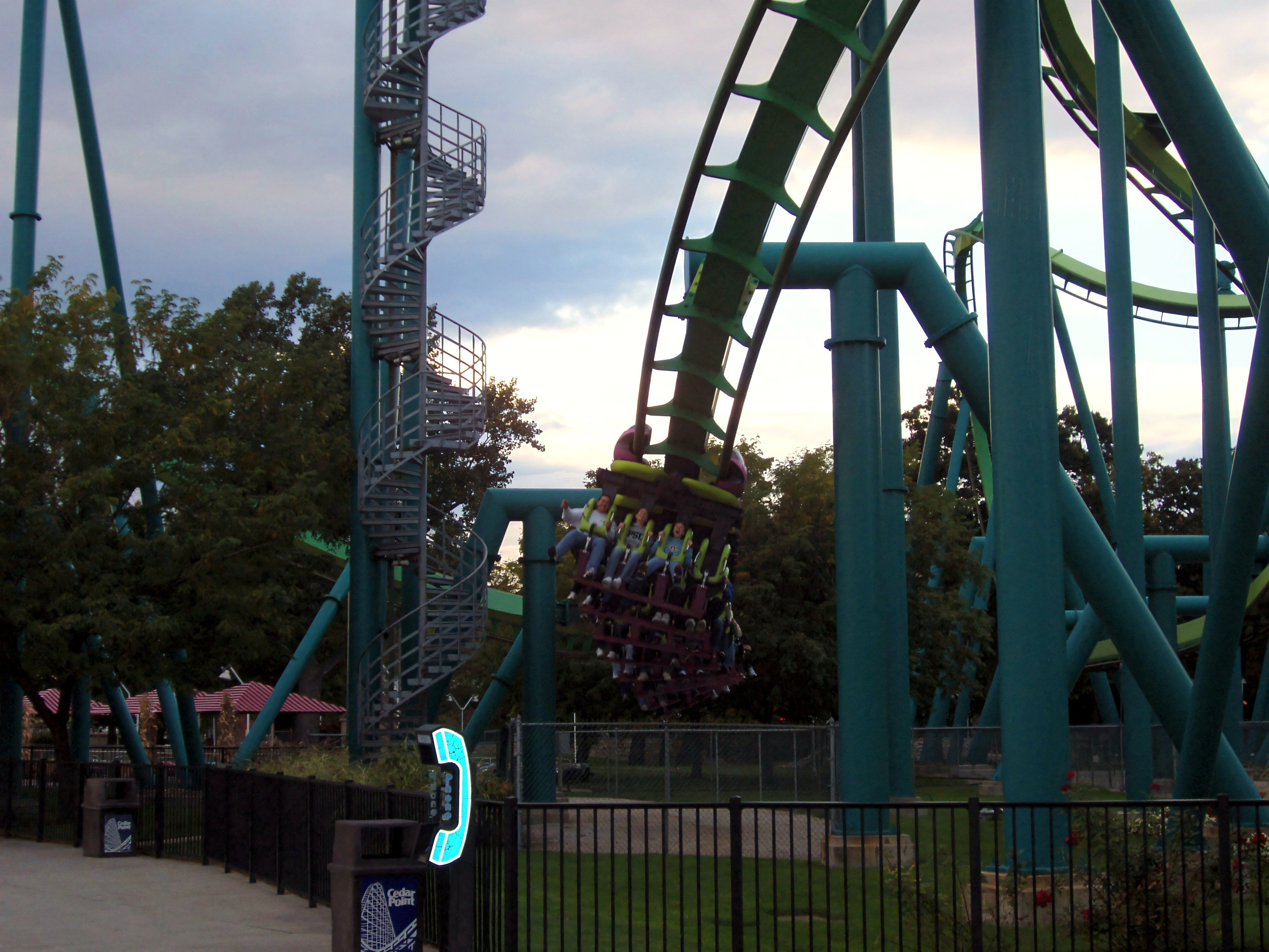 Raptor inverted train banking near spiral stairs, phone booth, Raptor, September 2006