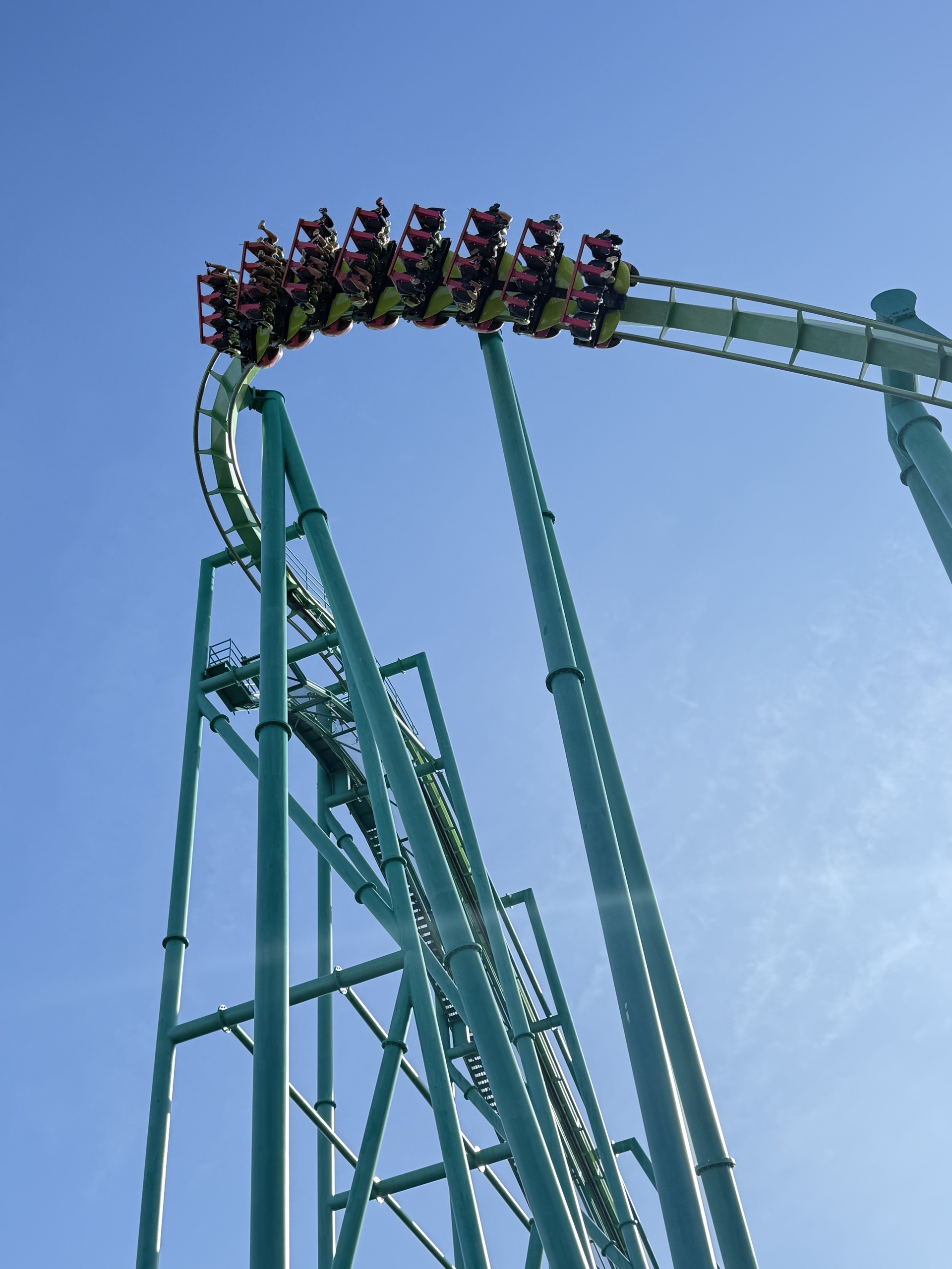 A full Raptor train at the crest of the lift above the teal supports