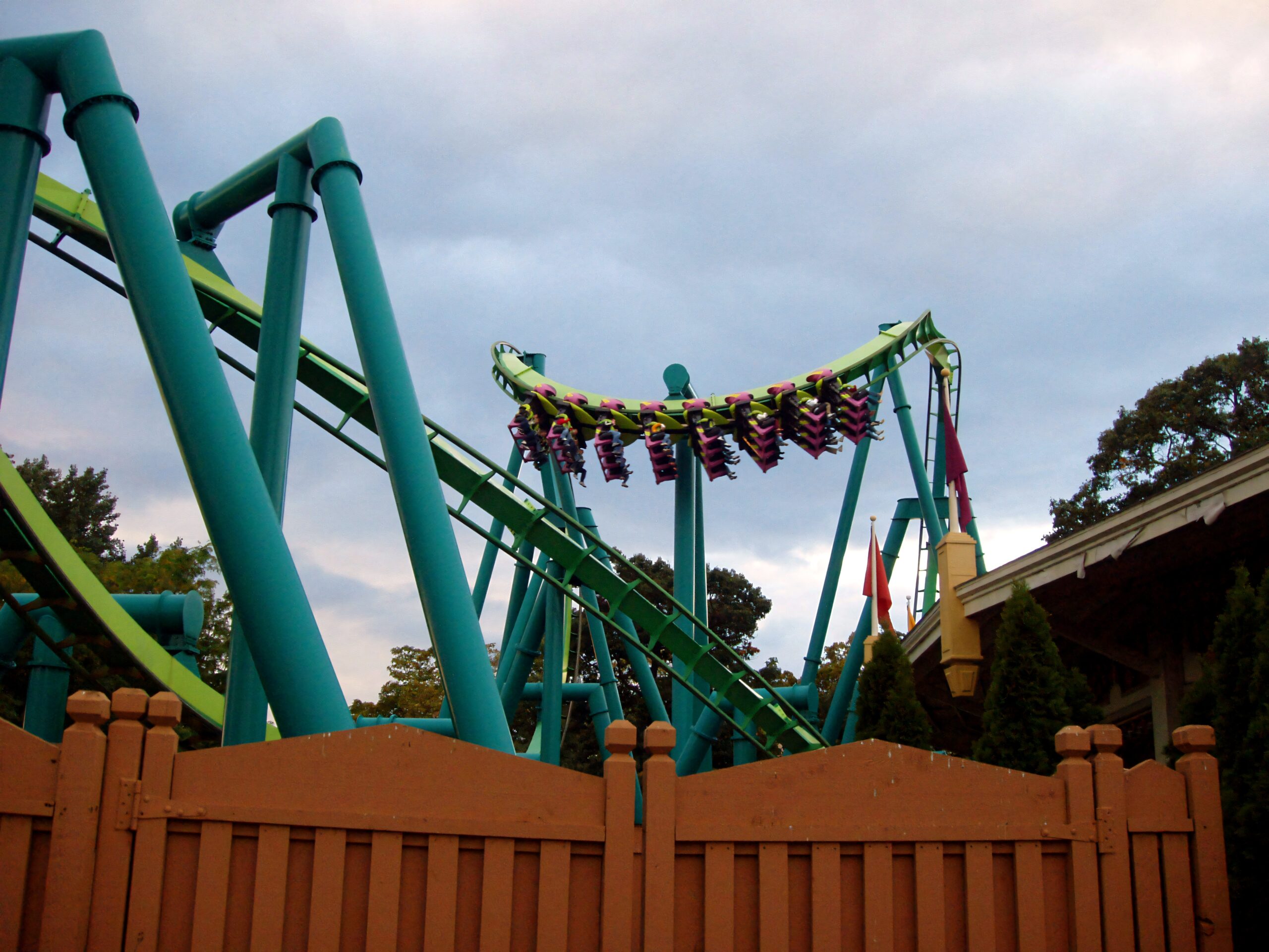 A Raptor train crossing above the fence line at dusk at Cedar Point, September 2006