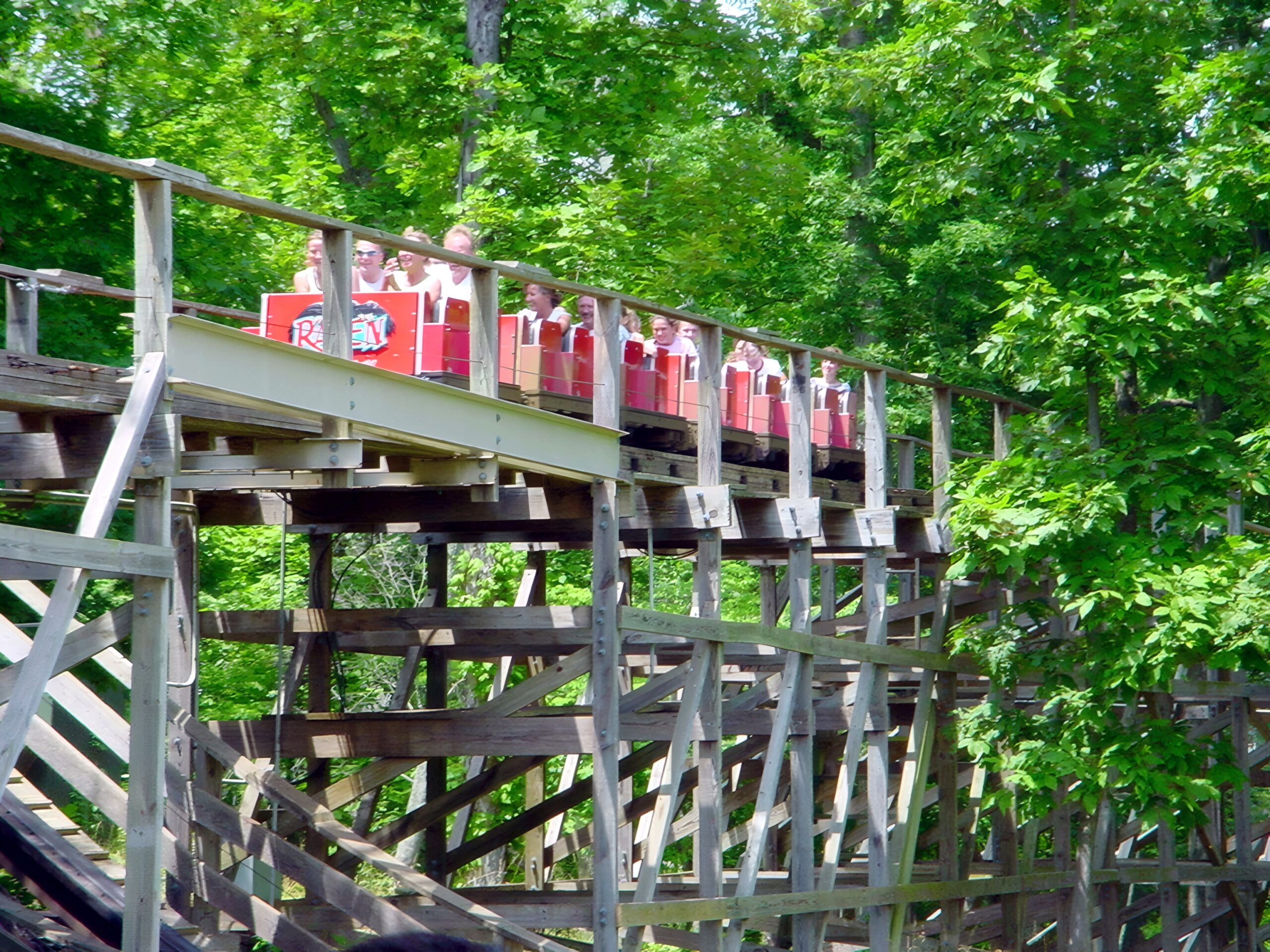 A full Raven train climbing the wooden lift hill, July 2002