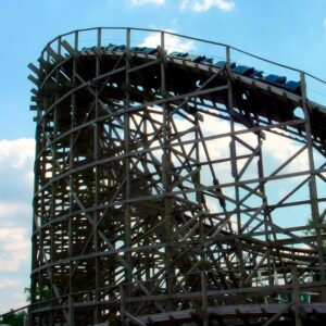 Roar at Six Flags America: a train on the wooden structure against the clouds