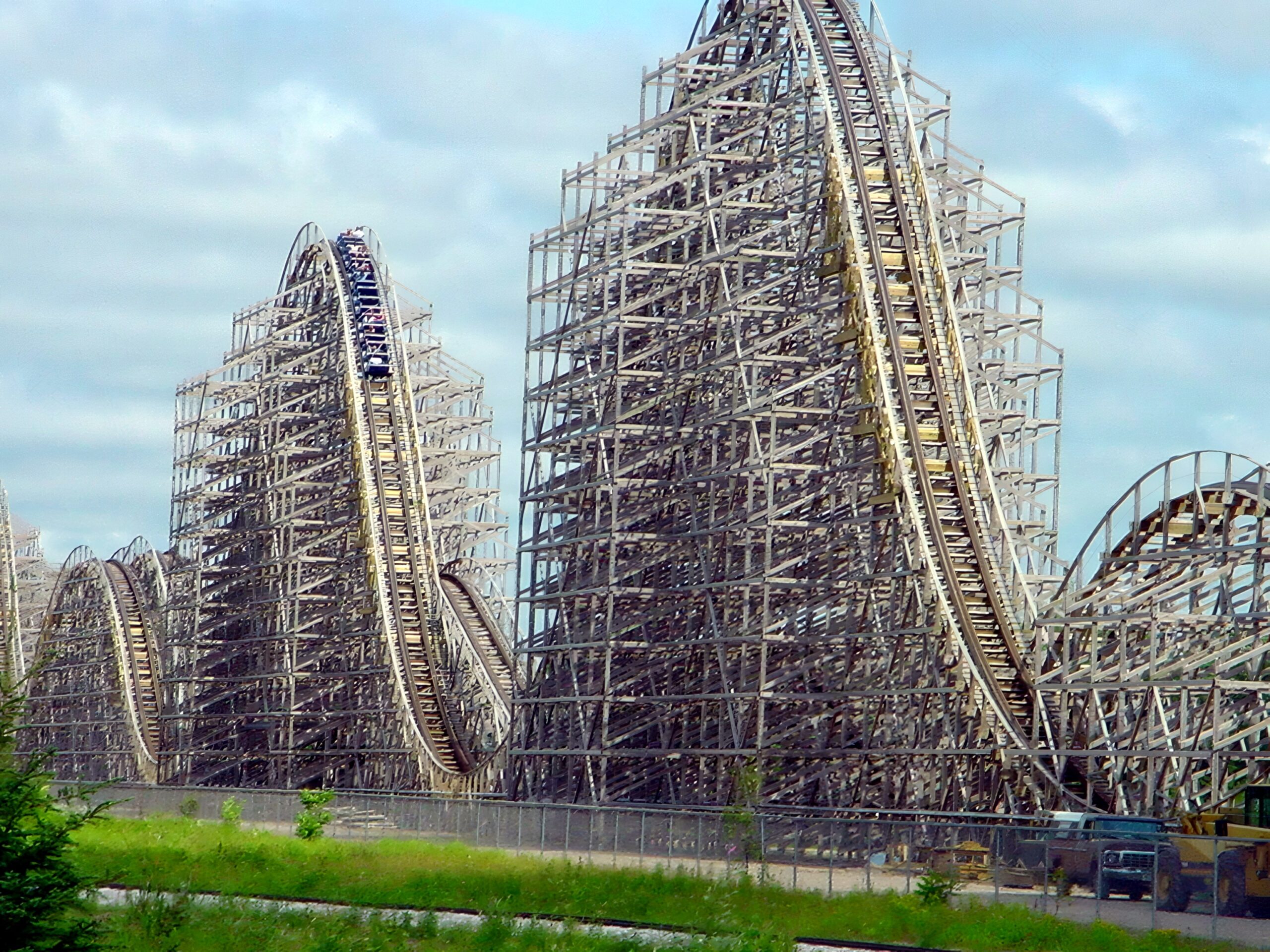 A Shivering Timbers train cresting an airtime hill with the lift hill behind, June 2002