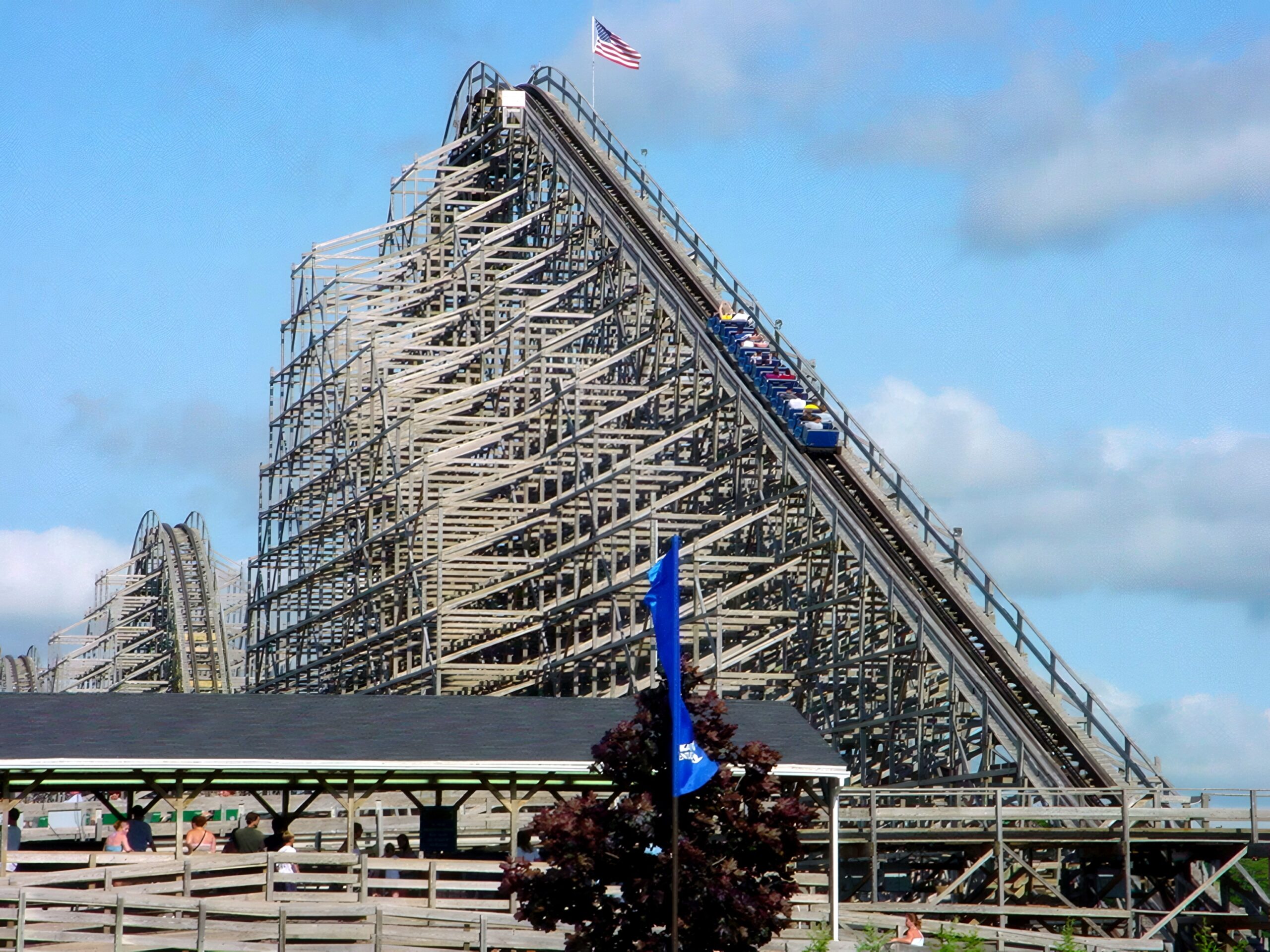 Shivering Timbers train near the top of the lift hill with the station below, June 2002