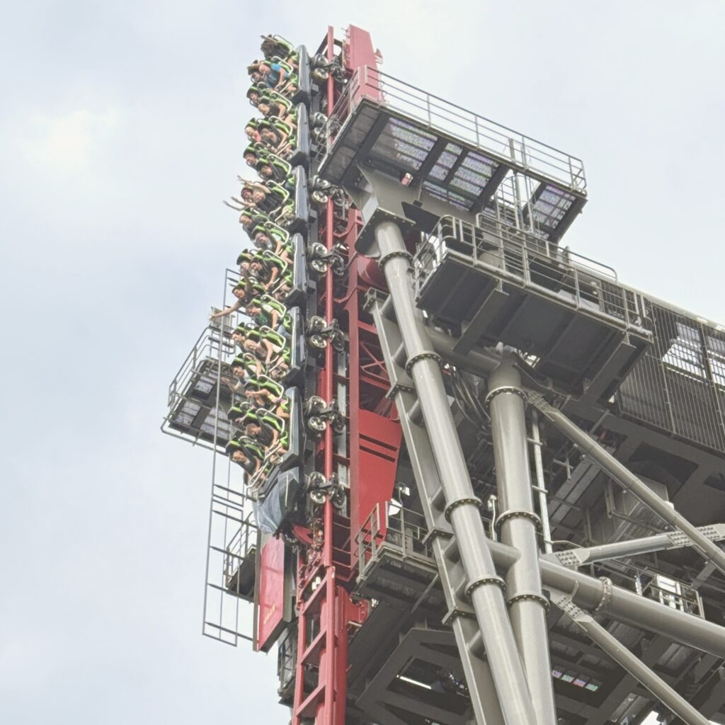 A Siren's Curse train hanging vertical on the tilt section at Cedar Point, September 2026