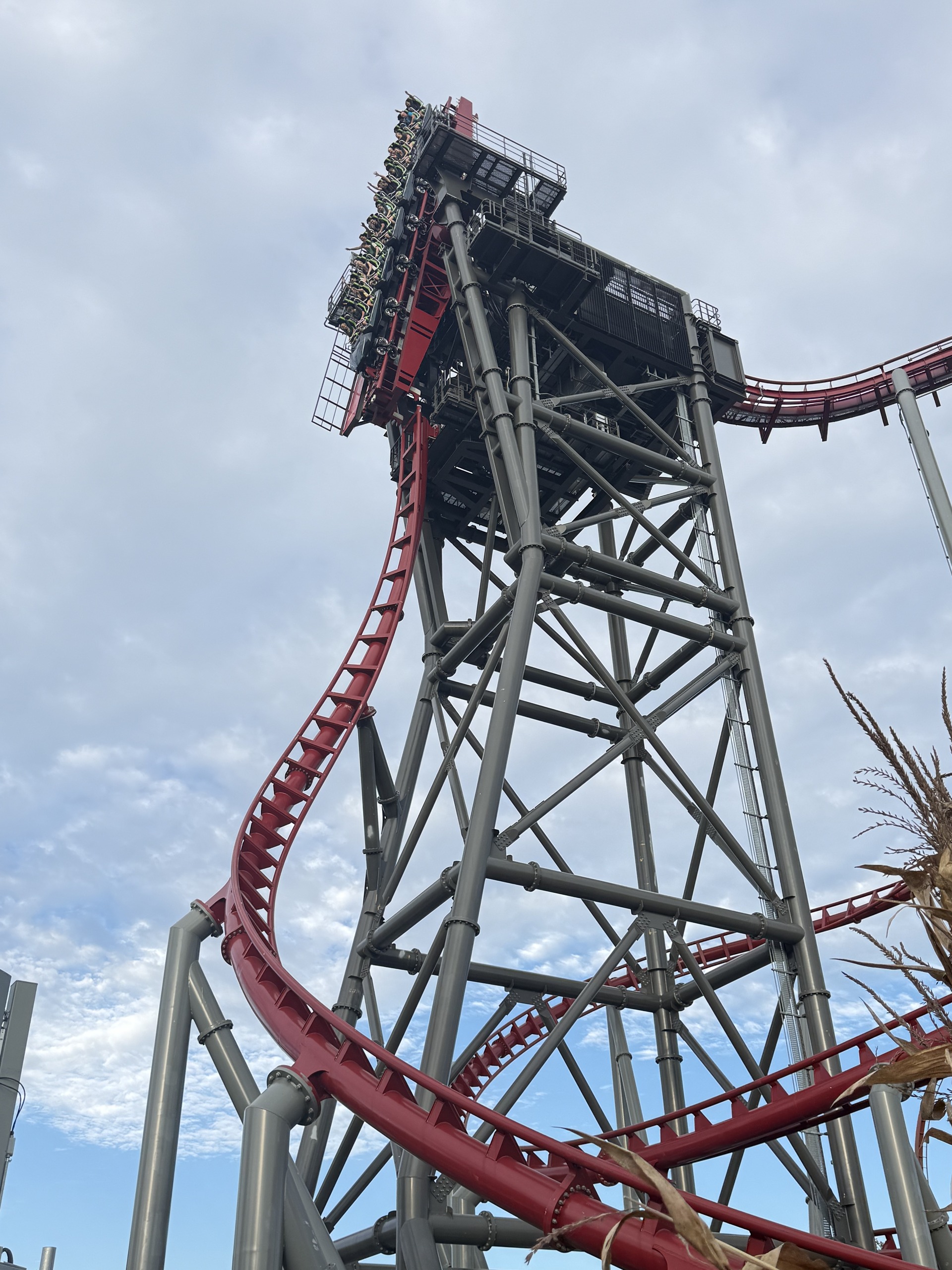The Siren's Curse tilt track with a train tipping over, low angle in evening light
