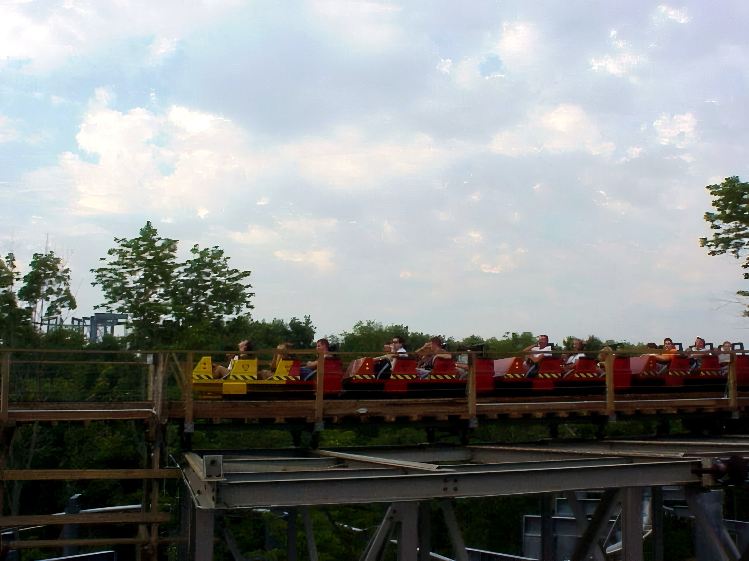 A Son of Beast train crossing the trestle above the trees at Kings Island, August 2000