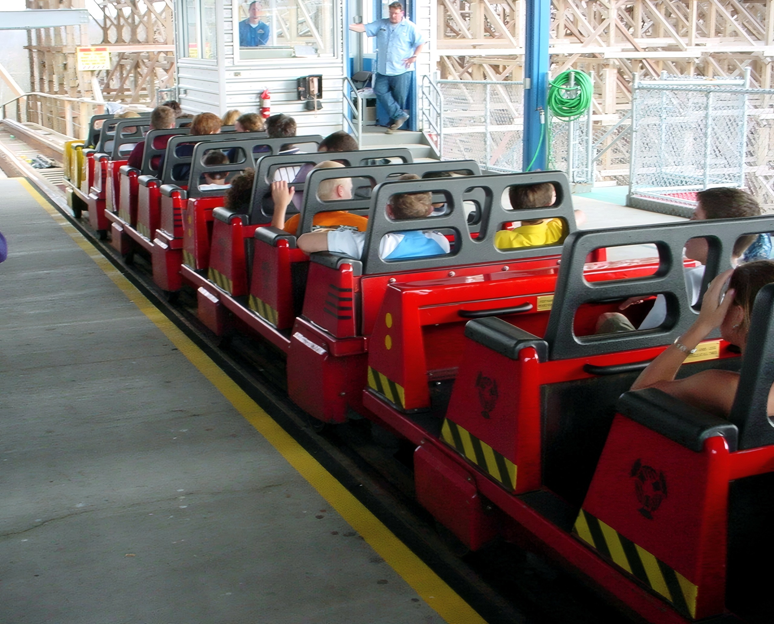A red Son of Beast train loading in the station at Kings Island, April 2002