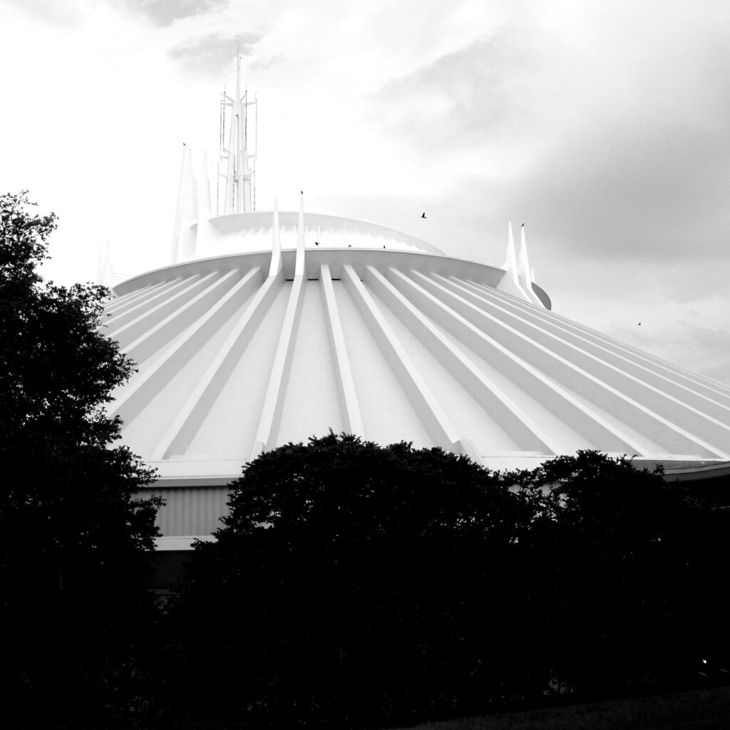 Space Mountain exterior above trees, blue sky, Space Mountain
