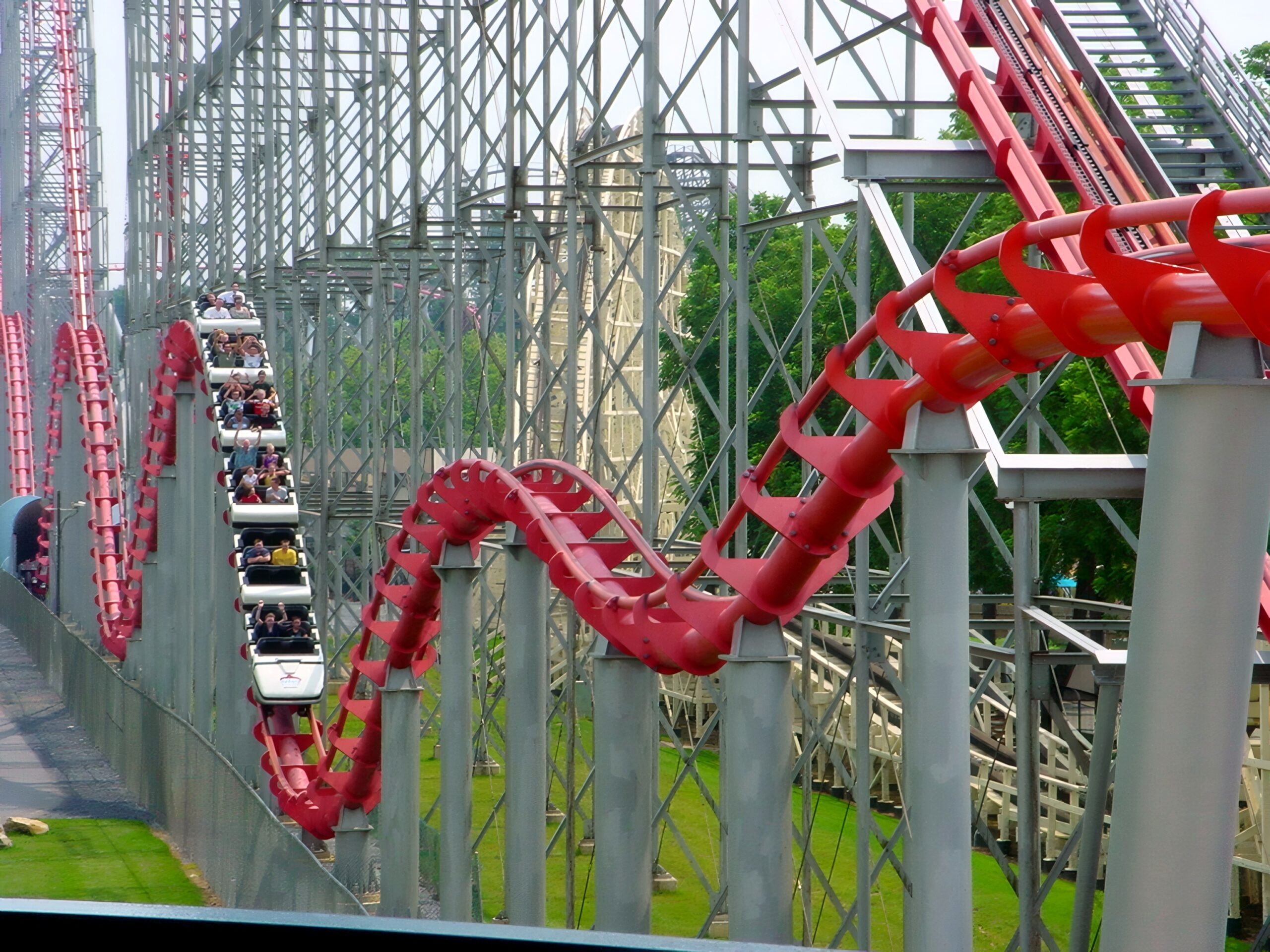 A Steel Force train on the return hills beside Thunderhawk, July 2001