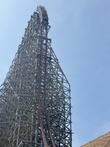 A Steel Vengeance train cresting the lift hill into the first drop at Cedar Point
