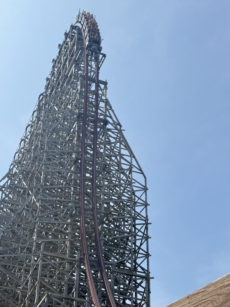 A Steel Vengeance train cresting the lift hill into the first drop at Cedar Point