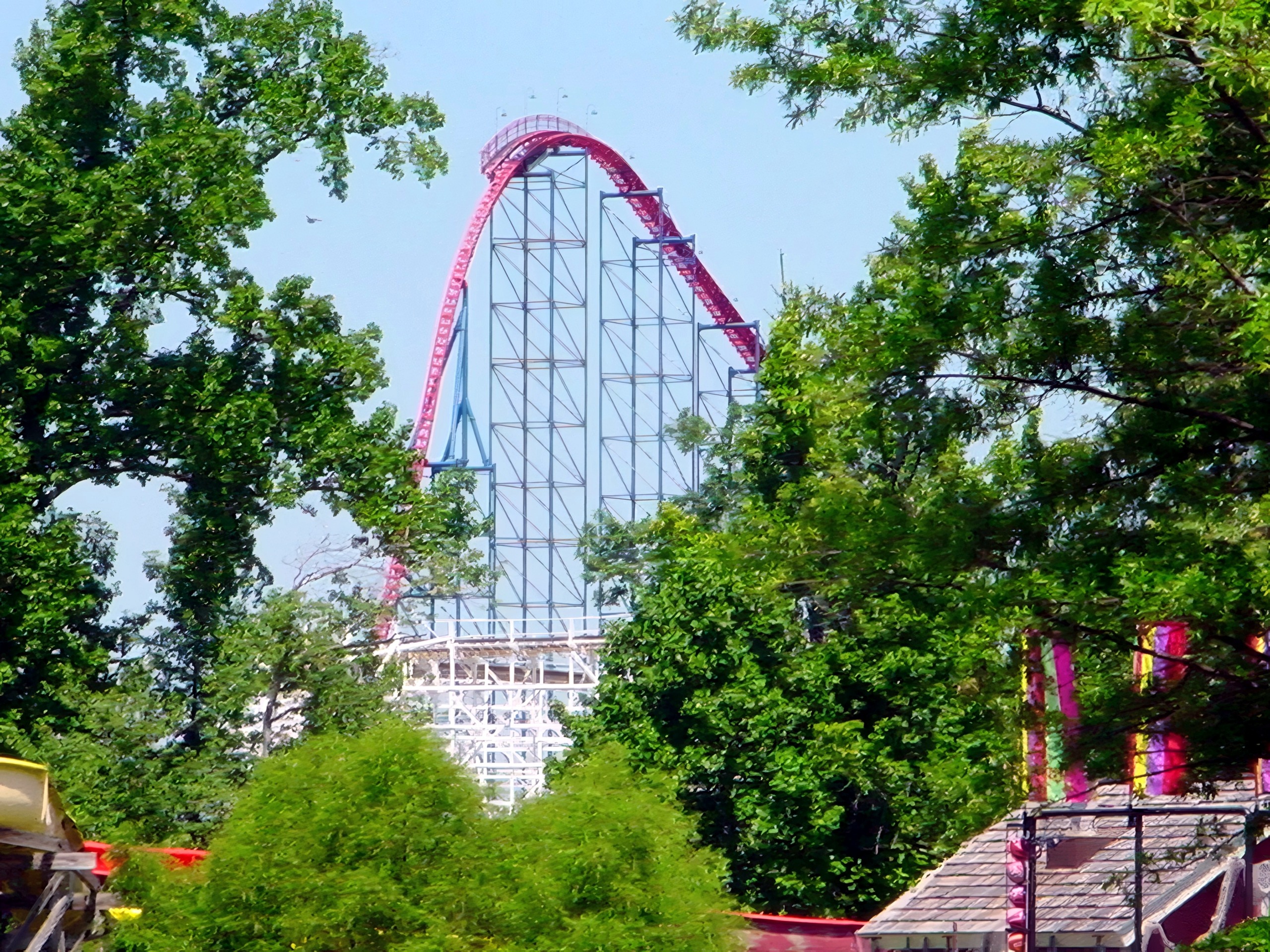 Superman: Ride of Steel's red lift hill above the trees at Six Flags America, July 2001