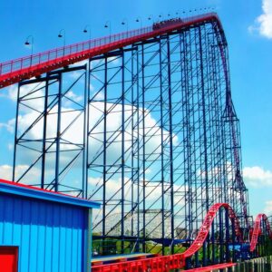 Superman: Ride of Steel at Six Flags America: a train cresting the 200-foot lift hill above the blue lattice
