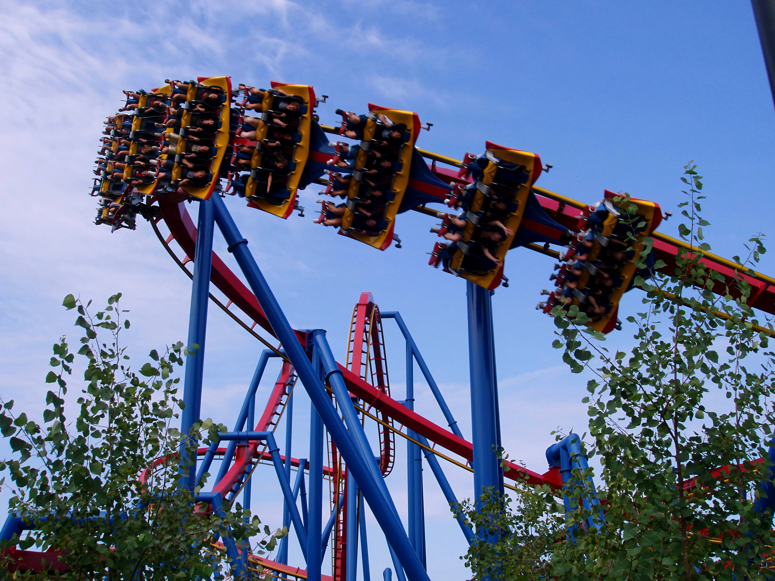 Riders face down on a Superman: Ultimate Flight train cresting a hill at Six Flags Great America, August 2005