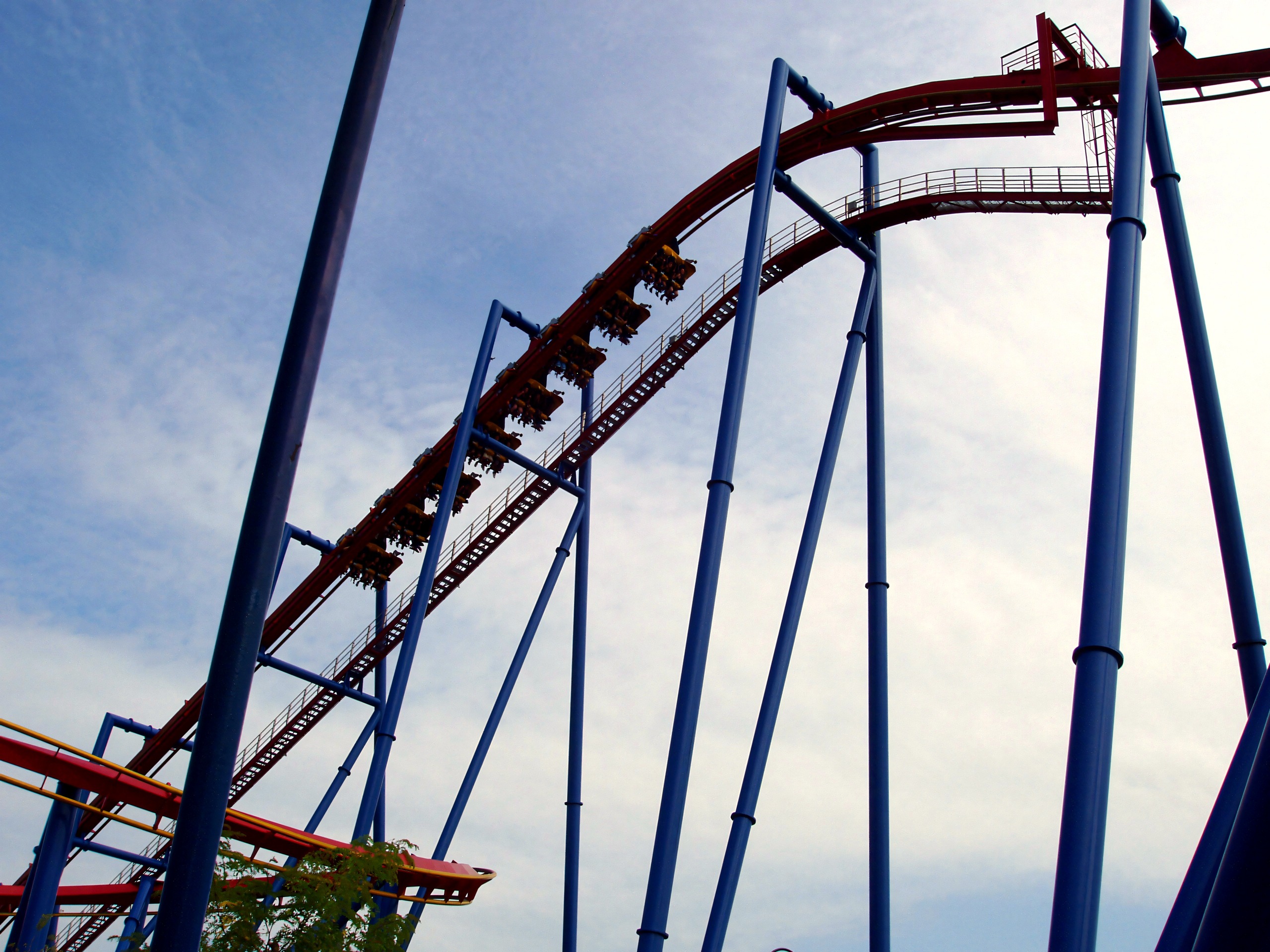 A Superman: Ultimate Flight train climbing the lift against a hazy sky at Six Flags Great America, August 2005