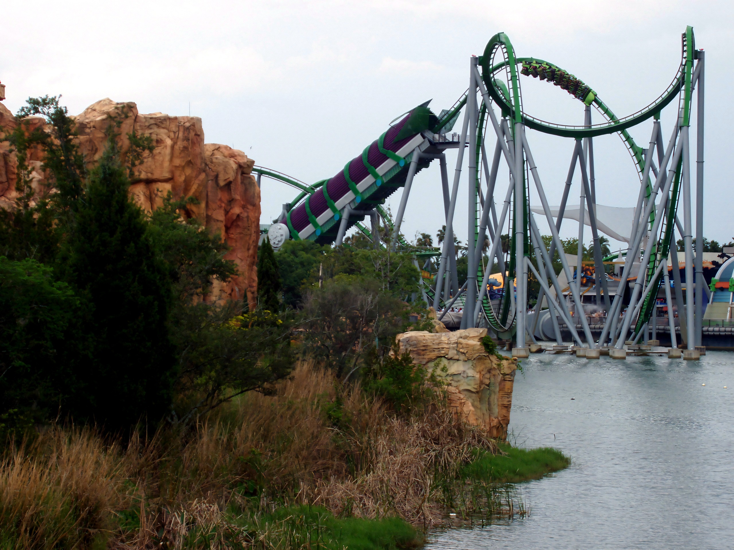 Train diving toward the lagoon with the loops beyond, The Incredible Hulk Coaster, July 2006