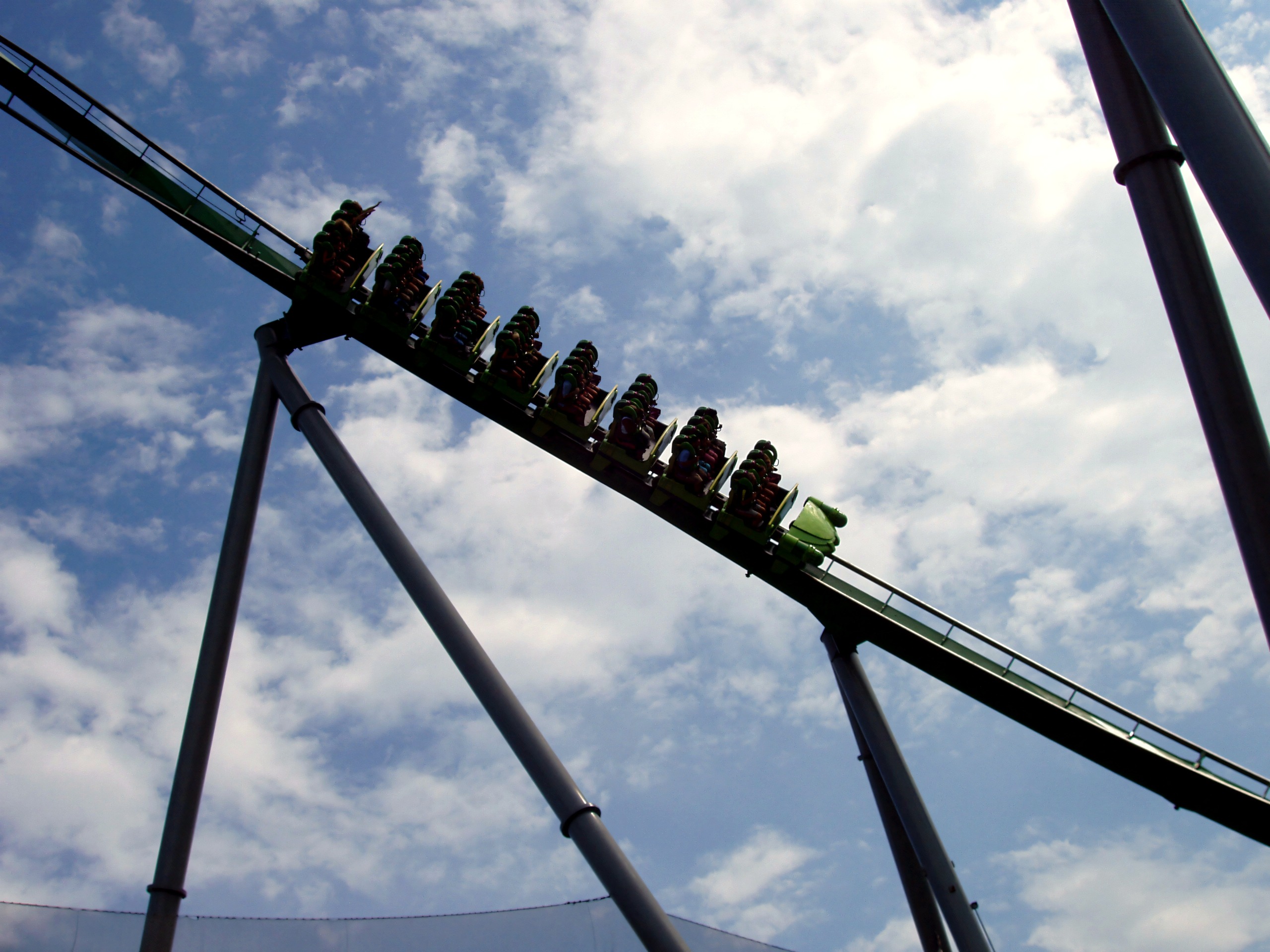 Train launching skyward, riders visible, The Incredible Hulk Coaster, July 2006