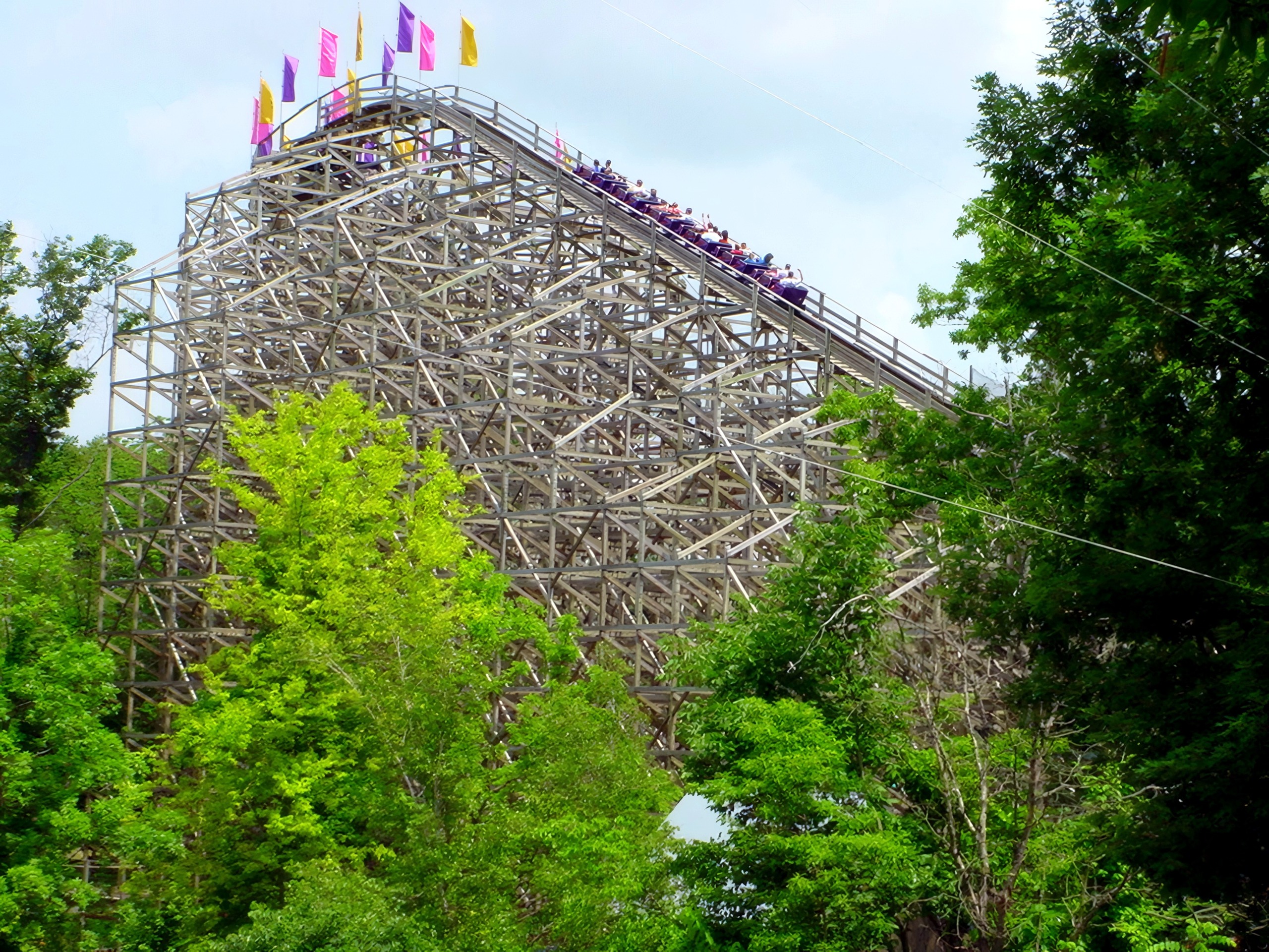 A Legend train cresting the lift hill with the flags flying, July 2002