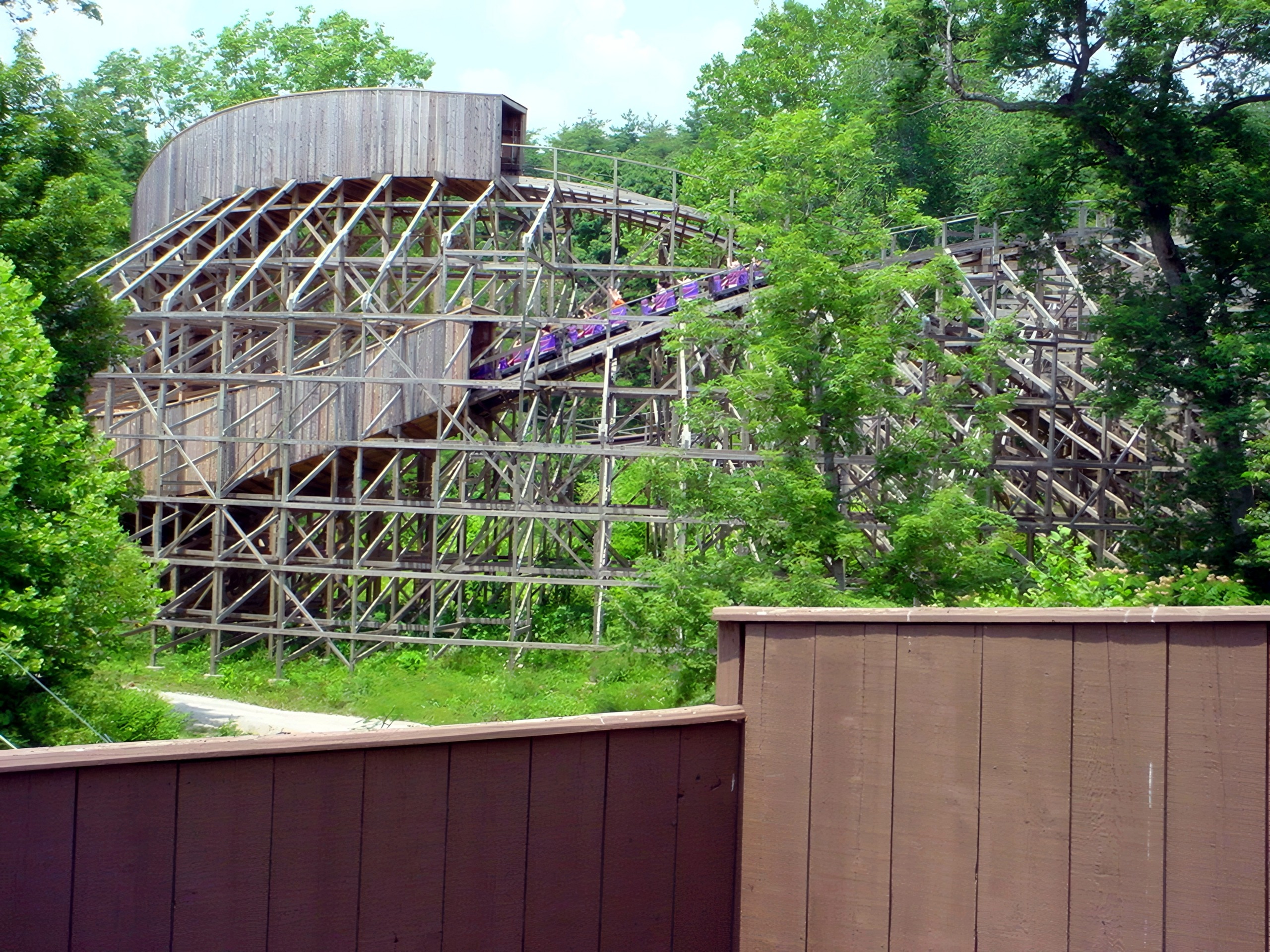 A Legend train descending the curve behind the fence, July 2002