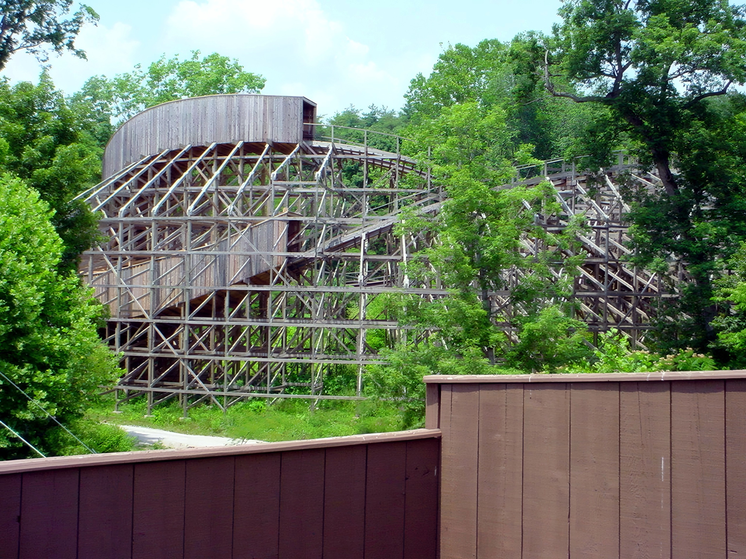 The Legend's lift hill and turn viewed over a fence, July 2002