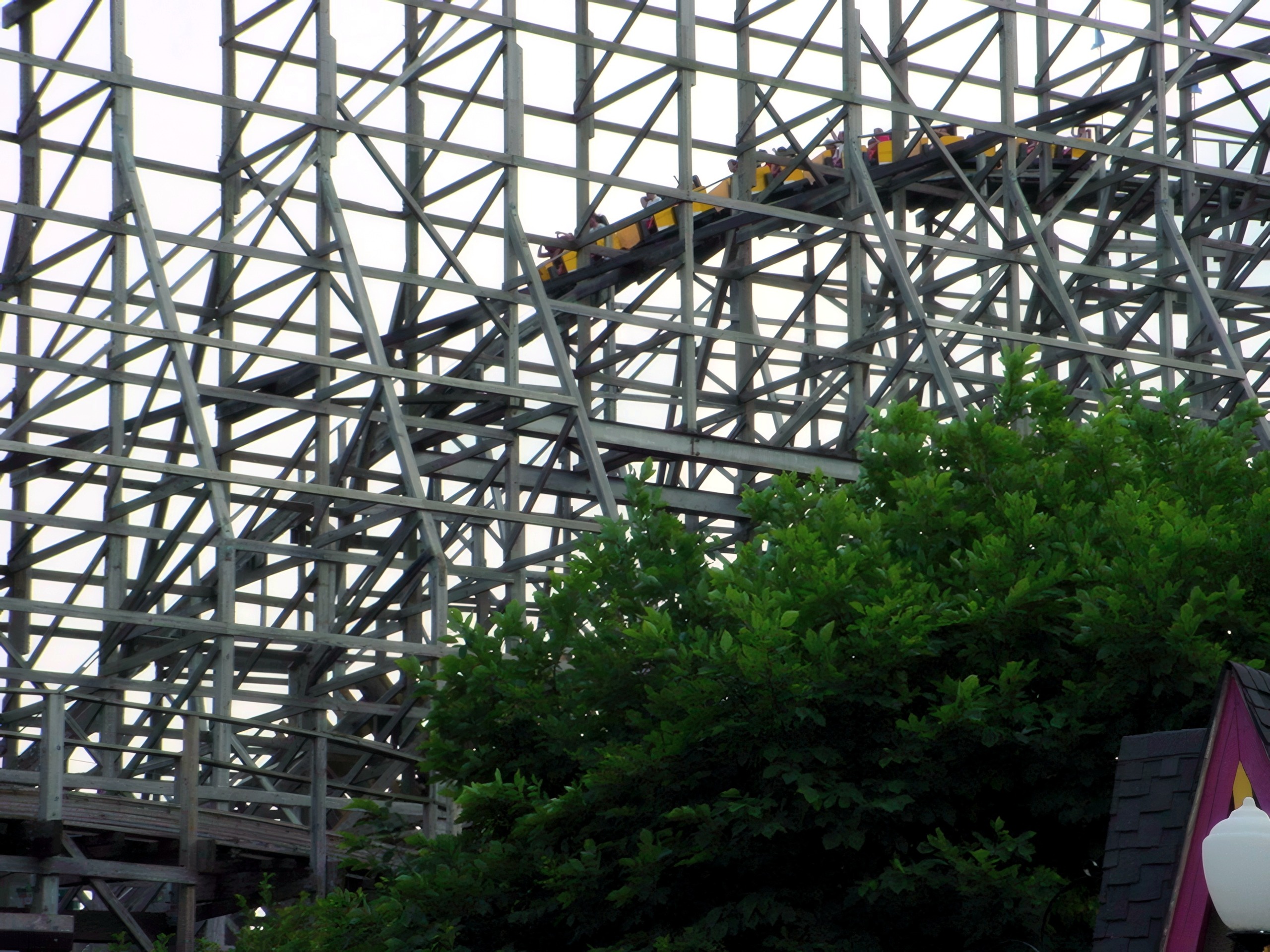 A Thunder Run train racing through the upper wooden structure at Six Flags Kentucky Kingdom, July 2002