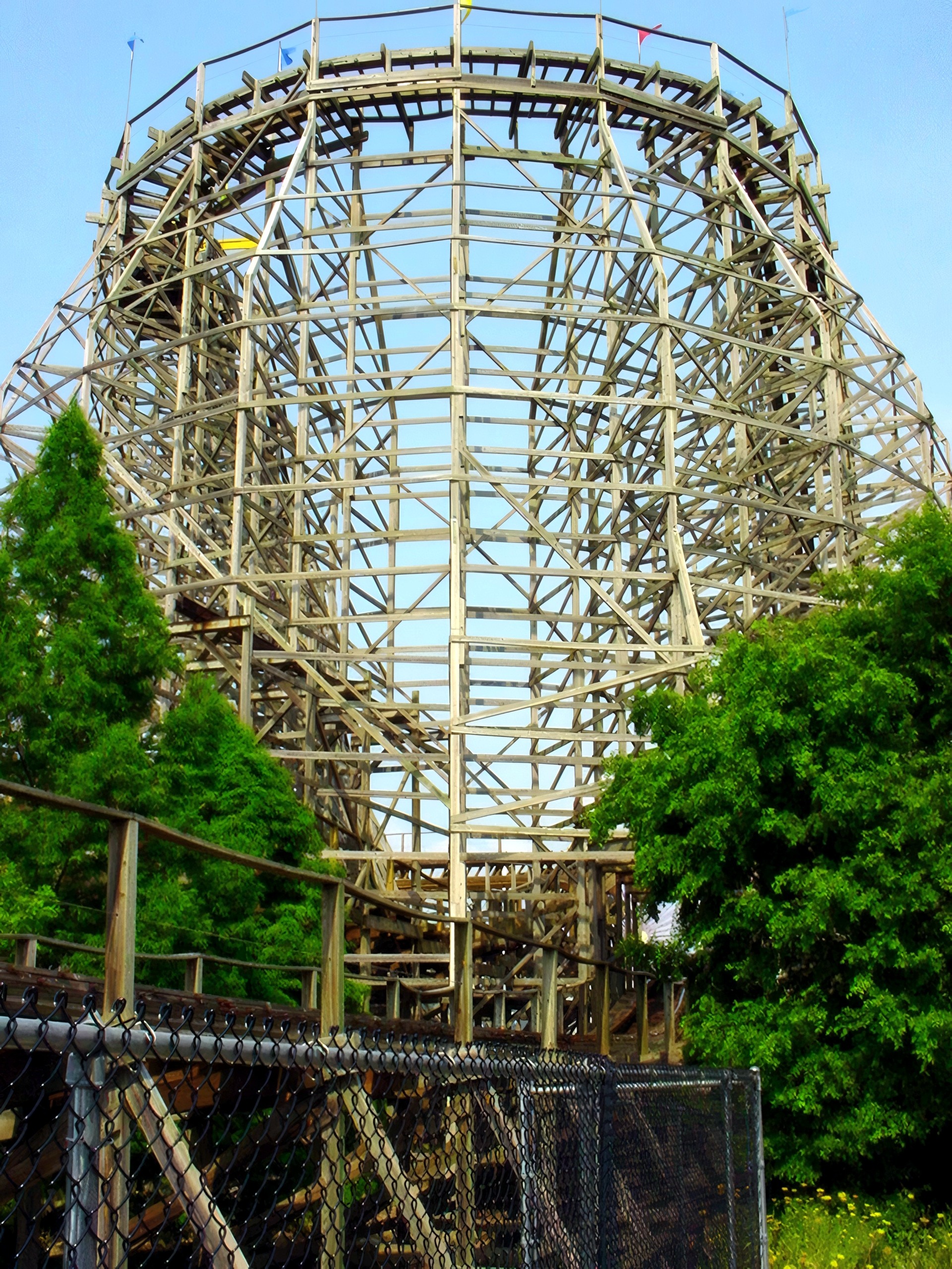 Thunder Run's tall curved turnaround behind the fence at Six Flags Kentucky Kingdom, July 2002