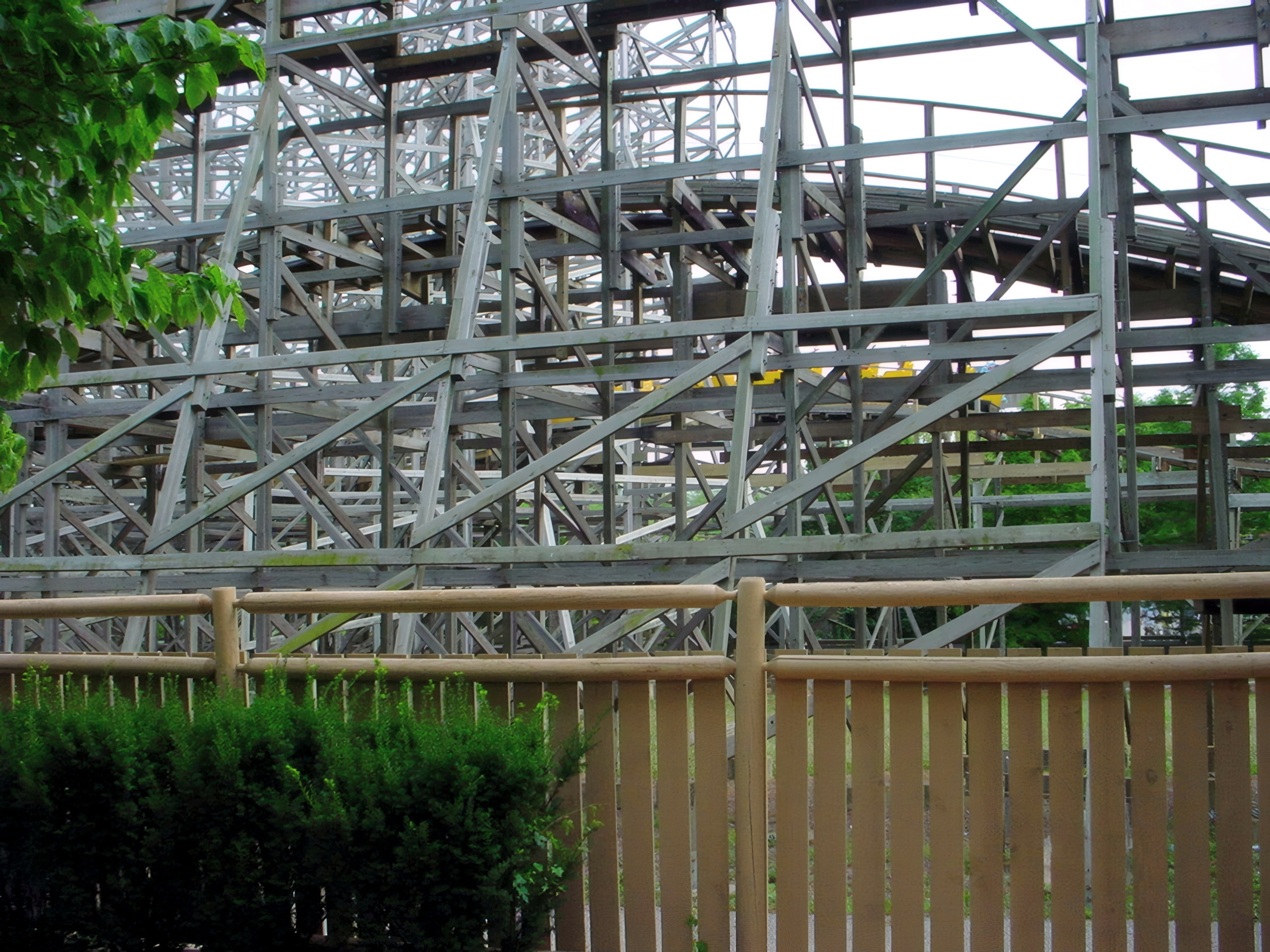 Thunder Run's wooden structure rising above the fence line at Six Flags Kentucky Kingdom, July 2002