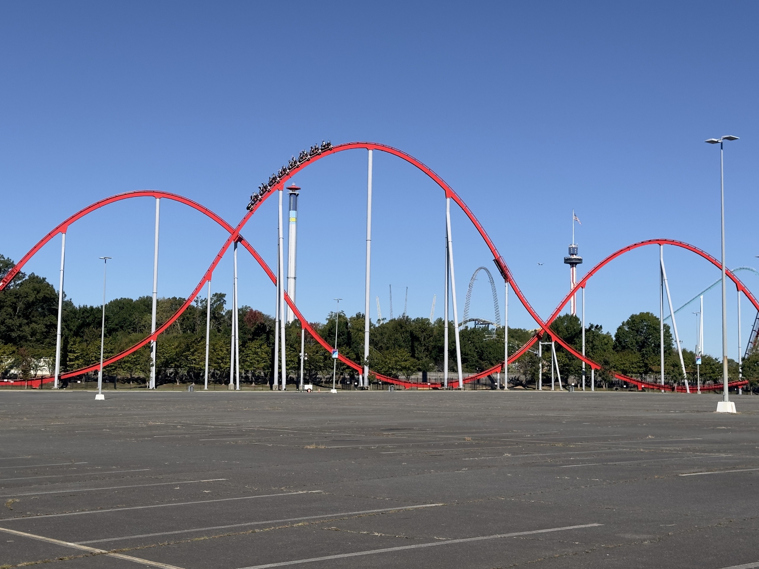 A Thunder Striker train on top of a camelback hill, Carowinds, October 2024