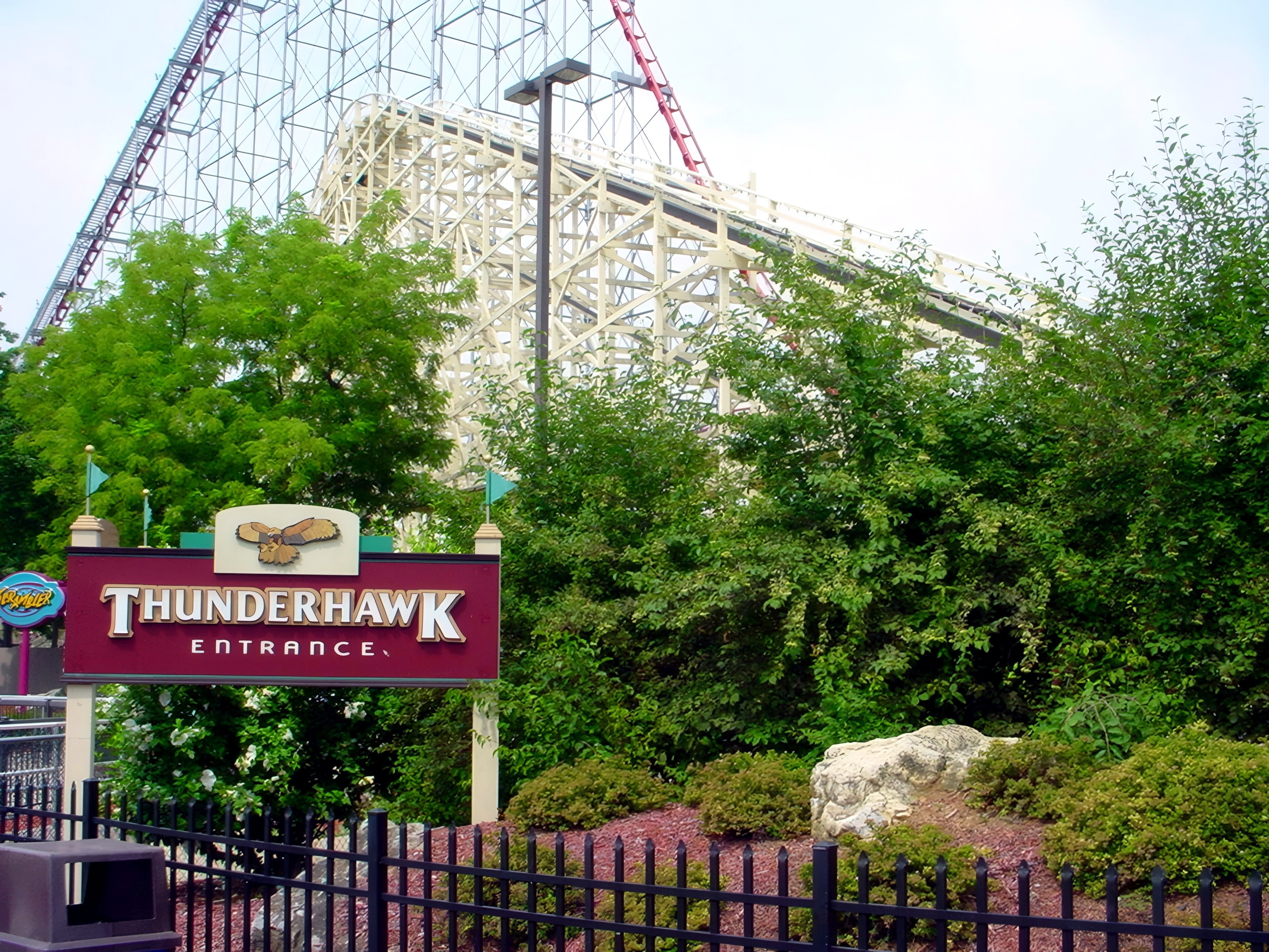 The Thunderhawk entrance sign below the white structure and Steel Force's track at Dorney Park, July 2001