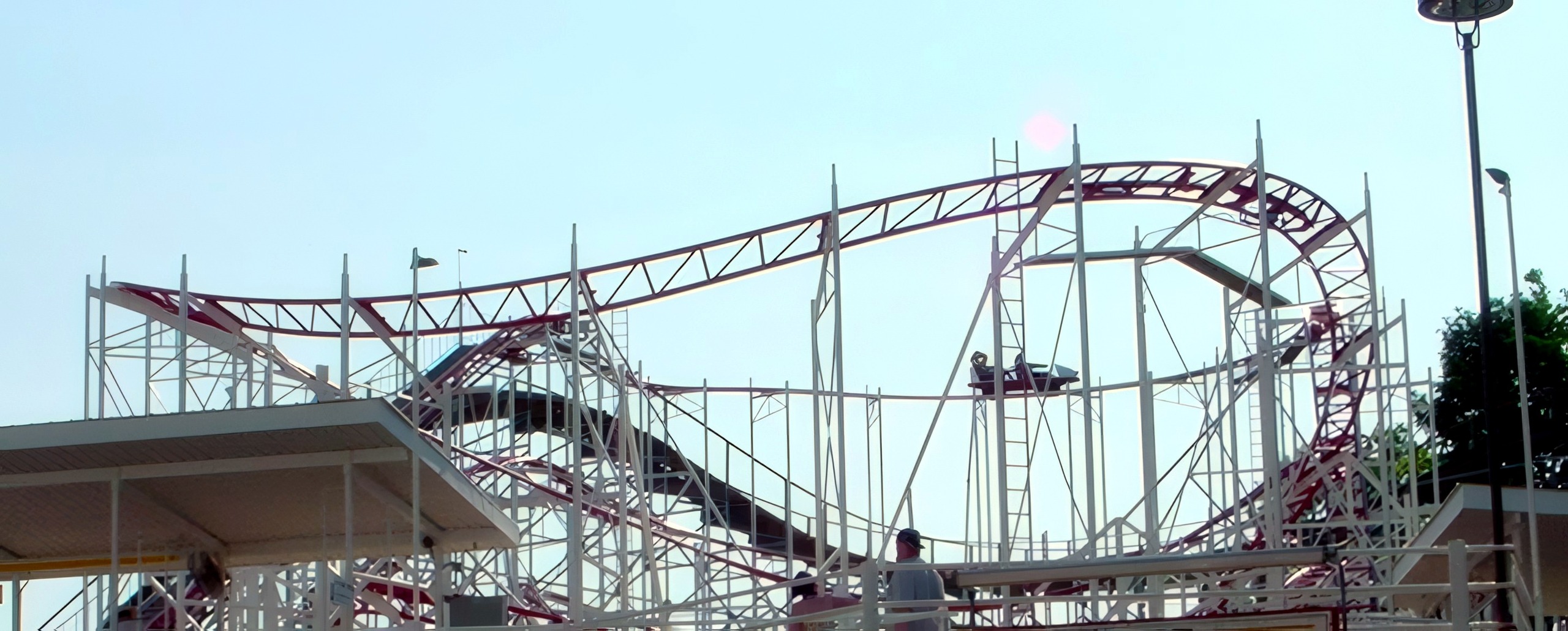 The Tig'rr Coaster's maroon track and white supports above the station at Indiana Beach, June 2002