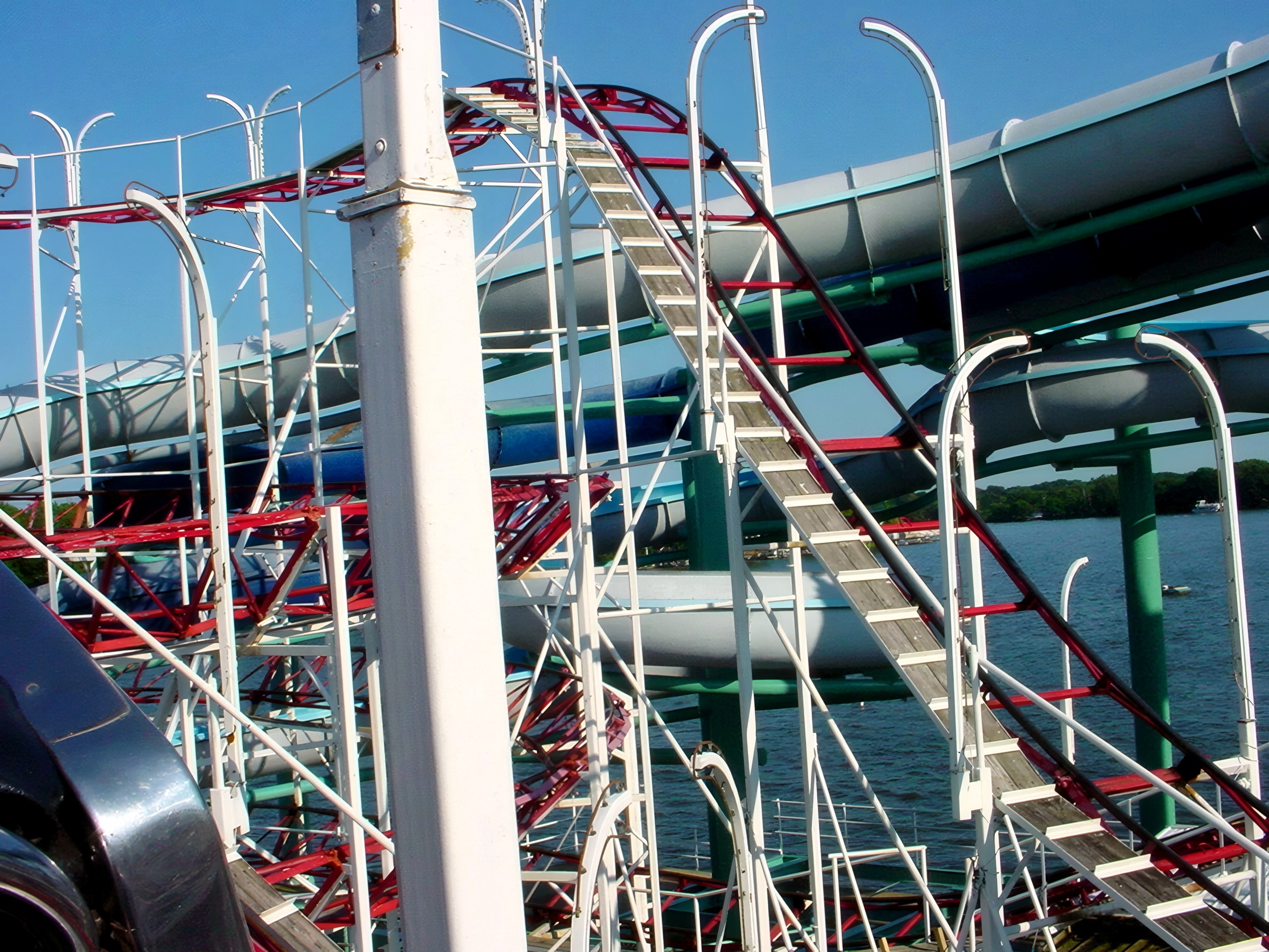 The Tig'rr Coaster's lift hill with the waterslides and lake behind at Indiana Beach, June 2002